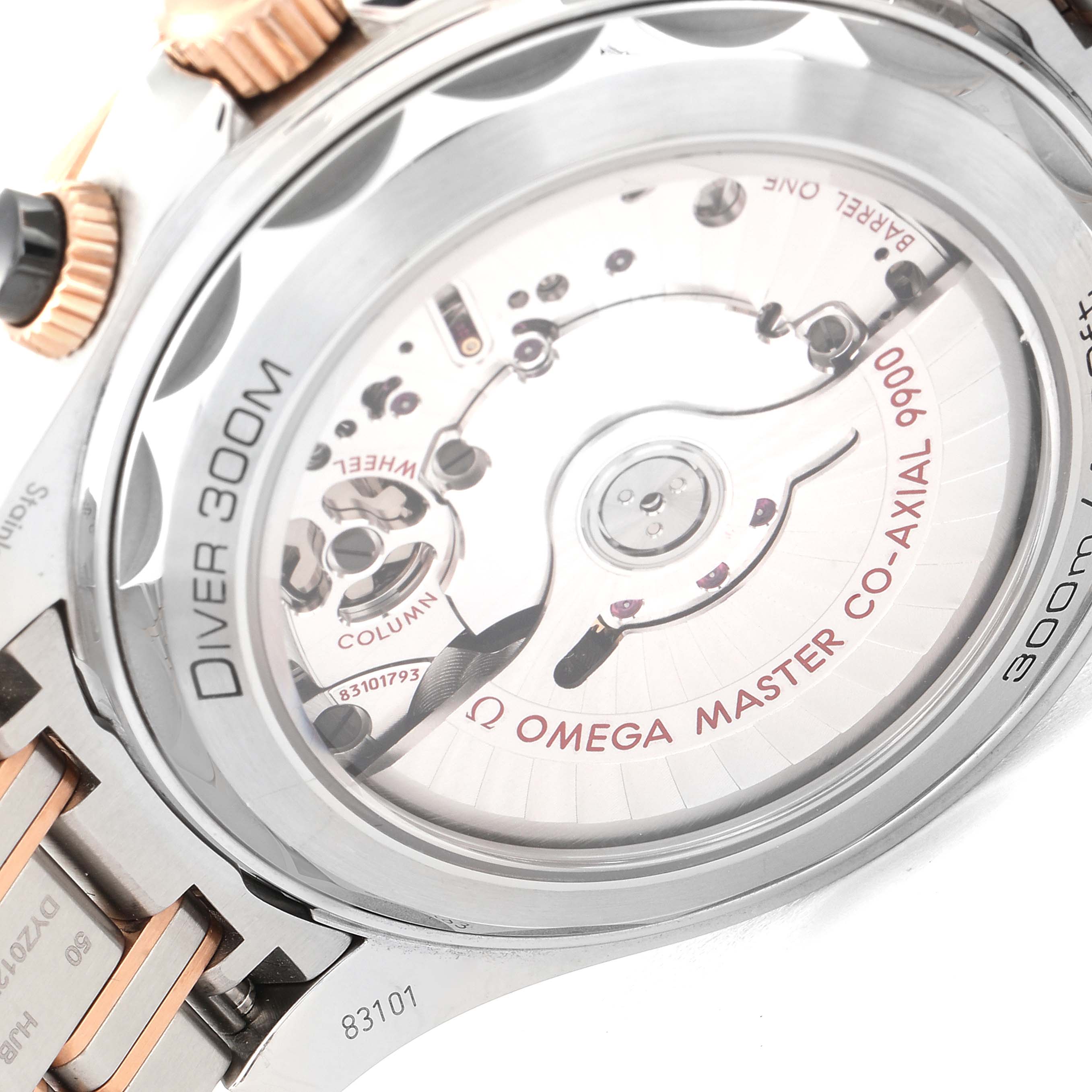 The image shows the backside of an Omega Seamaster 210.20.44.51.01.001 Men's Stainless Steel Black Dial 210.20.44.51.01.001 Men's Stainless Steel Black Dial watch, highlighting its Master Co-Axial 9900 movement through a transparent case back.