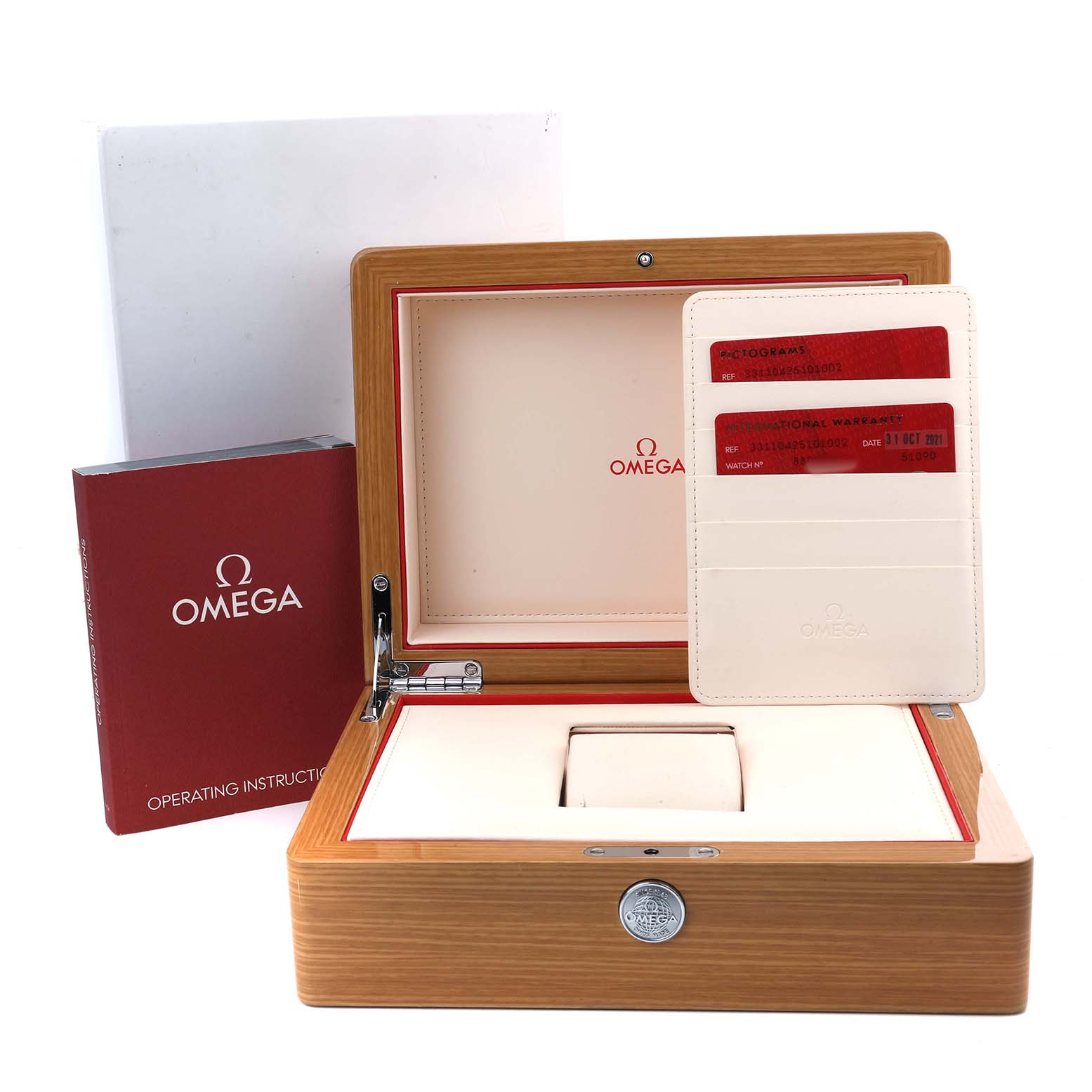 The image shows an Omega Speedmaster 331.10.42.51.01.002 Men's Stainless Steel Black Dial watch box, warranty cards, and an instruction manual from a front angle.