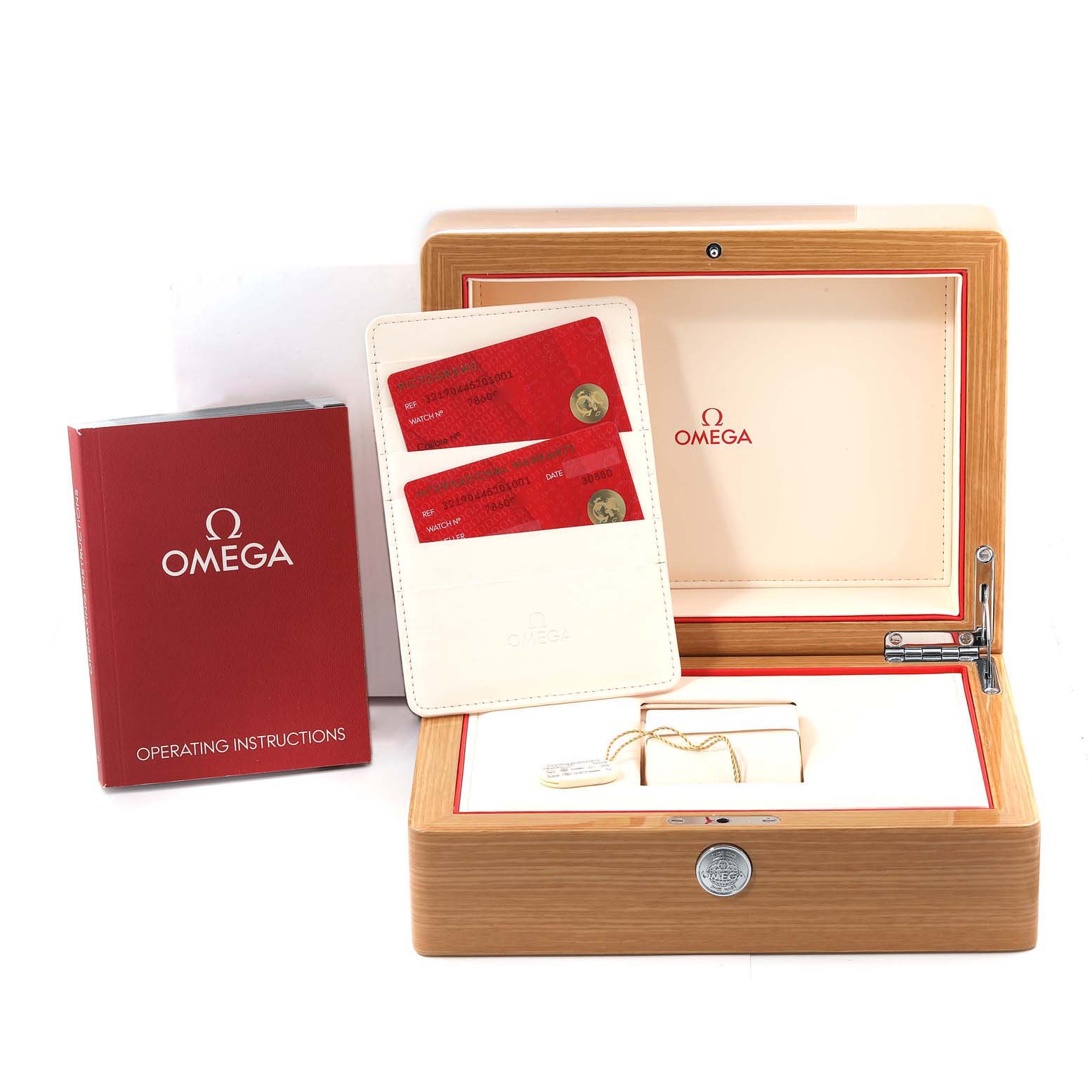 The image shows an Omega Speedmaster 321.90.44.52.01.001 Men
s Titanium Black Dial 321.90.44.52.01.001 Men
s Titanium Black Dial watch box, operating instructions, and warranty cards from a front angle.