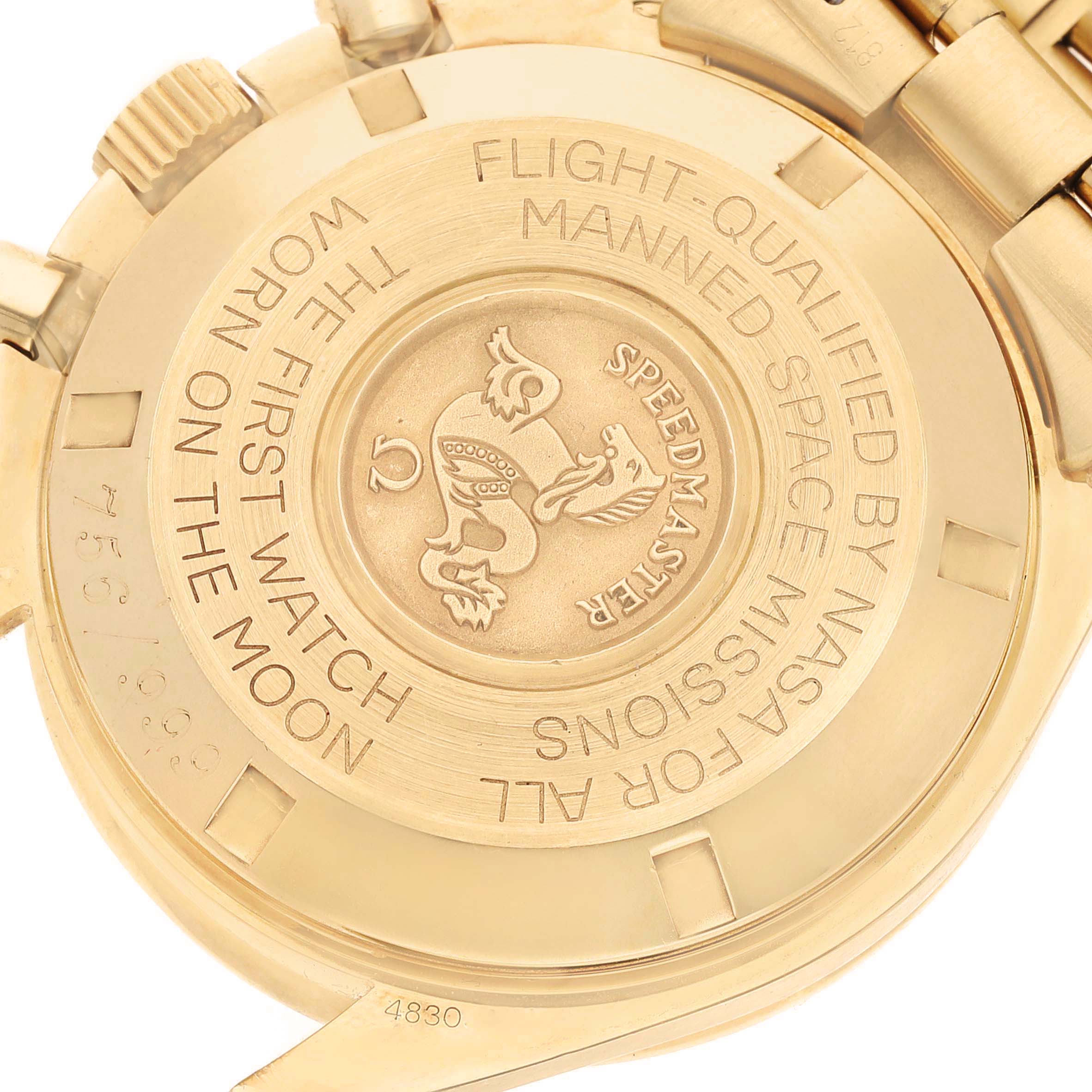 The image shows the case back of an Omega Speedmaster 3191.50.00 Men's Yellow Gold Black Dial, highlighting the engraved logo and inscription.