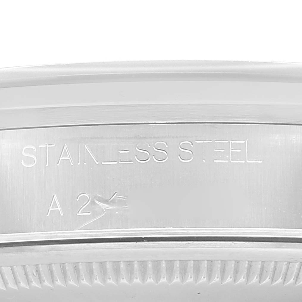 This close-up image of the Rolex Air-King 14000 Men's Stainless Steel Blue Dial 14000 Men's Stainless Steel Blue Dial model shows the "STAINLESS STEEL" engraving on the case back.