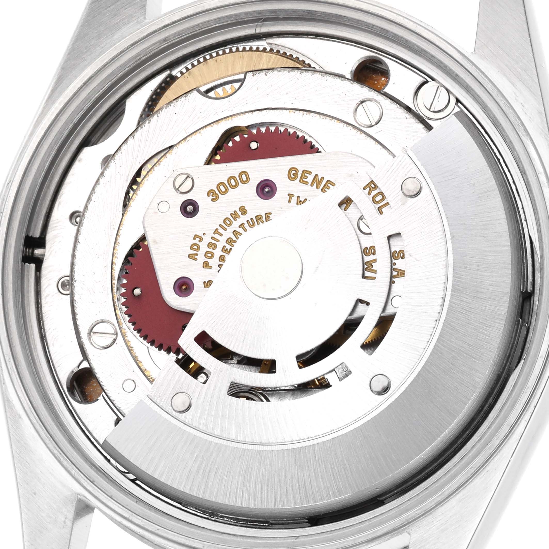 The image shows the movement of a Rolex Air-King 14000 Men's Stainless Steel Silver Dial 14000 Men's Stainless Steel Silver Dial from a rear view, highlighting its intricate mechanisms.