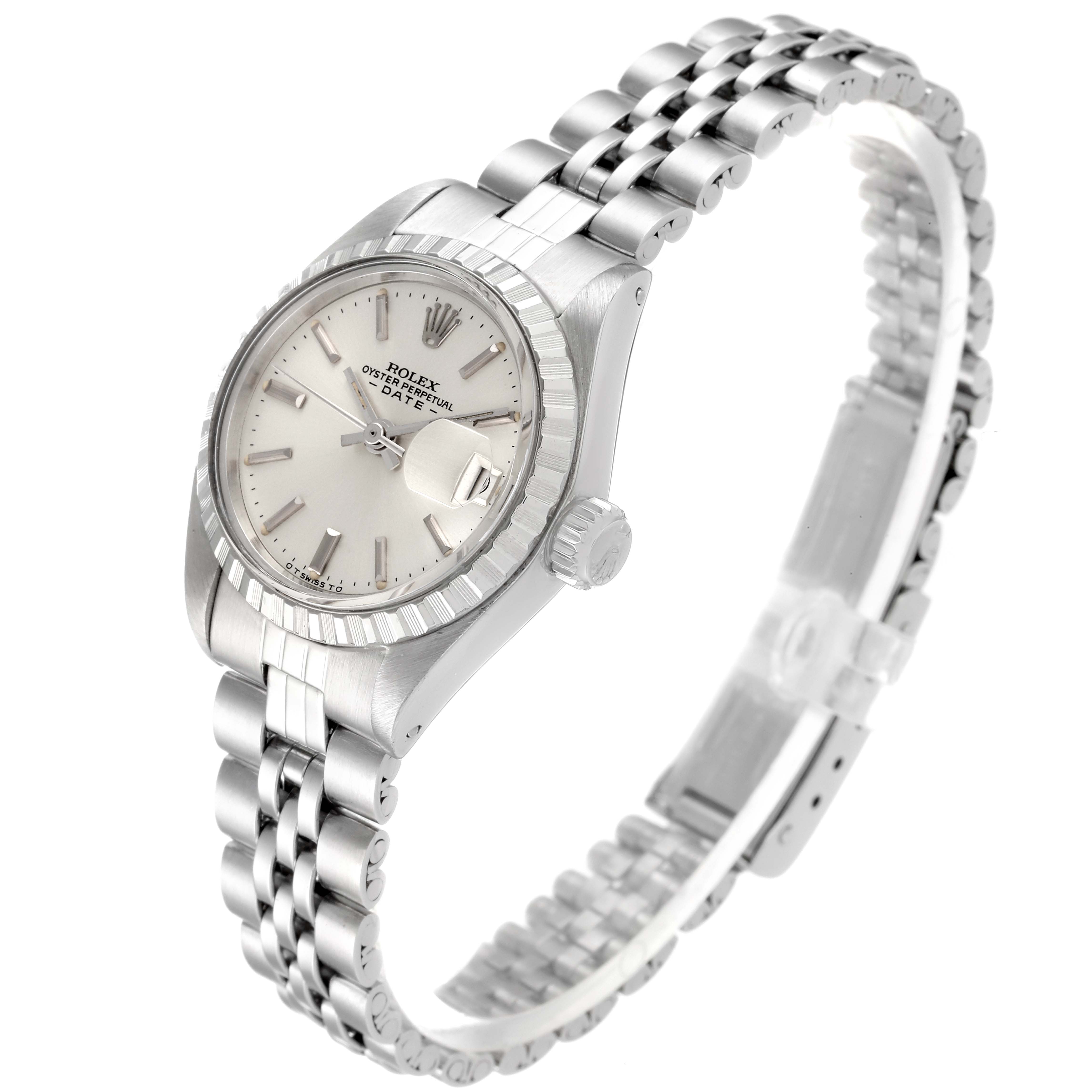 This image shows a Rolex Date 6924 Women
s Stainless Steel Silver Dial 6924 Women
s Stainless Steel Silver Dial model watch at an angled view, detailing the face, bezel, crown, and Jubilee bracelet.