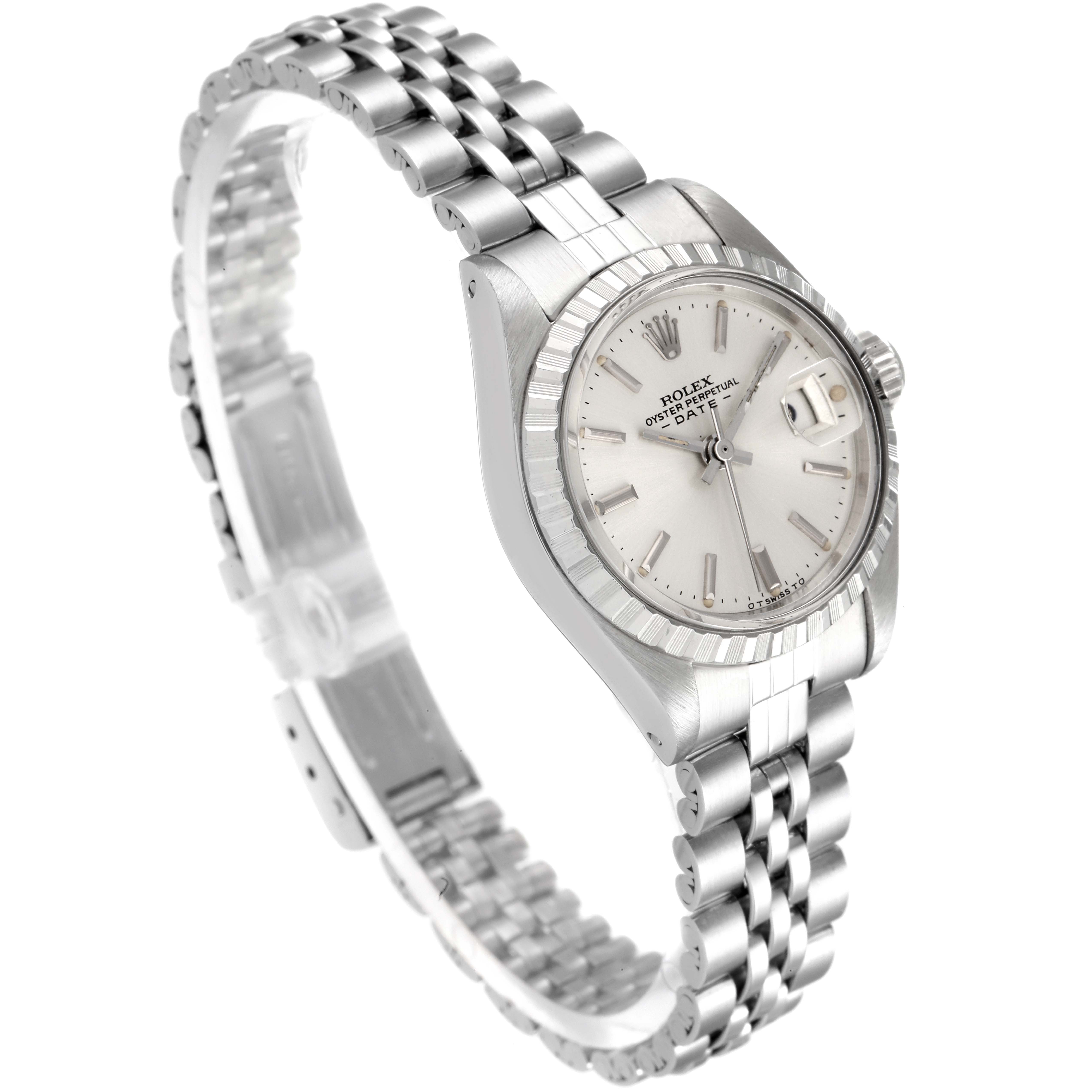 This image shows a side angle view of a Rolex Date 6924 Women
s Stainless Steel Silver Dial 6924 Women
s Stainless Steel Silver Dial model, displaying the watch face, bracelet, and crown.