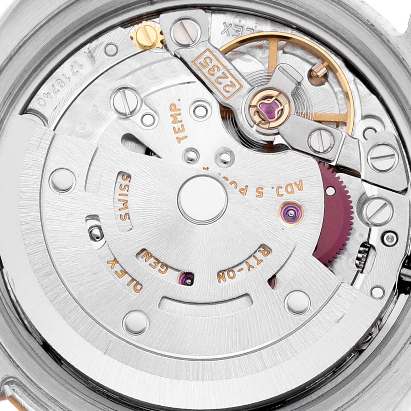 This image shows the internal mechanism of the Rolex Datejust 179173 Women's Steel and Gold (two tone) Grey Dial 179173 Women's Steel and Gold (two tone) Grey Dial watch, including gears and the rotor assembly.