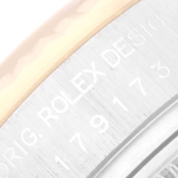The image shows a close-up of the side case of a Rolex Datejust 179173 Women's Steel and Gold (two tone) Grey Dial 179173 Women's Steel and Gold (two tone) Grey Dial watch, featuring the brand engraving and model number.