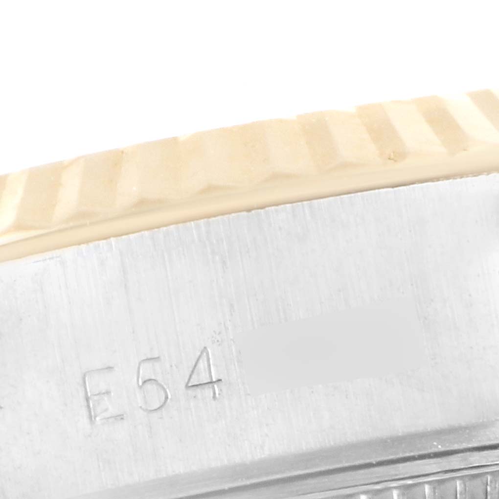 The image shows a close-up of the bezel and serial number engraving on a Rolex Datejust 69173 Women's Steel and Gold (two tone) Blue Dial 69173 Women's Steel and Gold (two tone) Blue Dial watch.