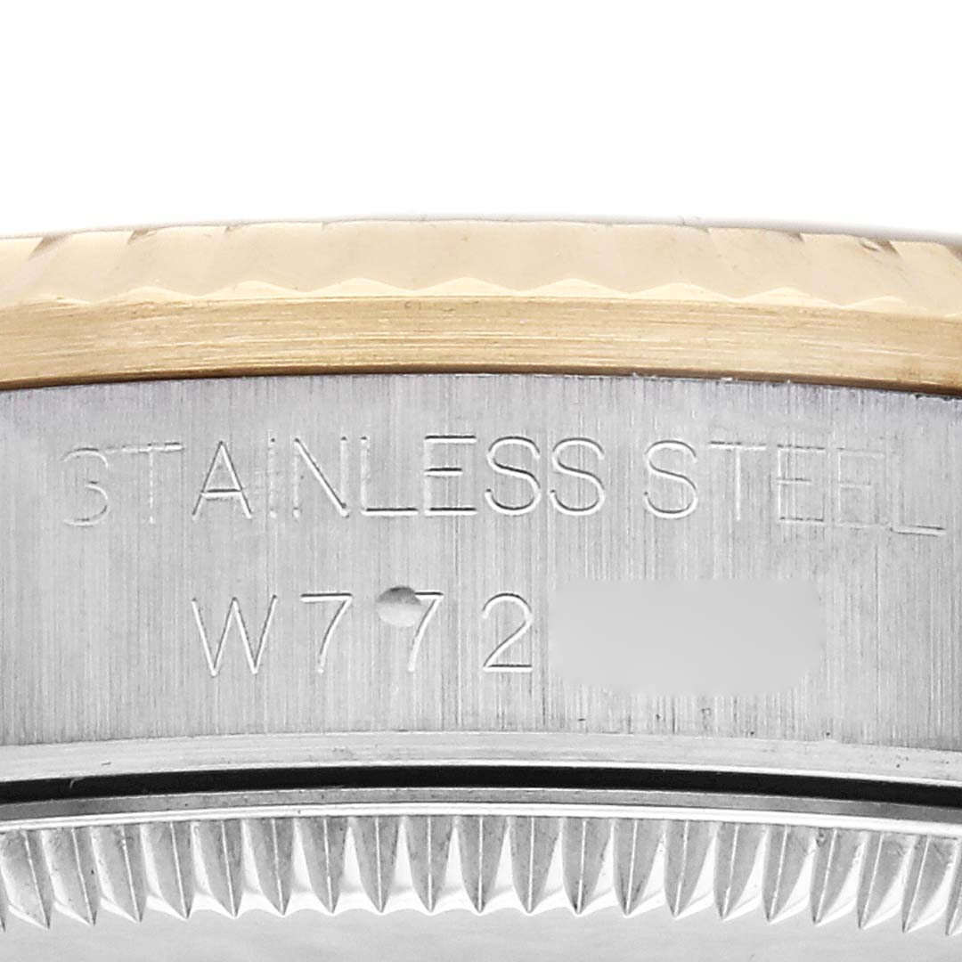 This image shows a close-up of the side of a Rolex Mid-Size 68273 Women's Steel and Gold (two tone) Champagne Dial 68273 Women's Steel and Gold (two tone) Champagne Dial watch, revealing its stainless steel casing and part of the bezel.