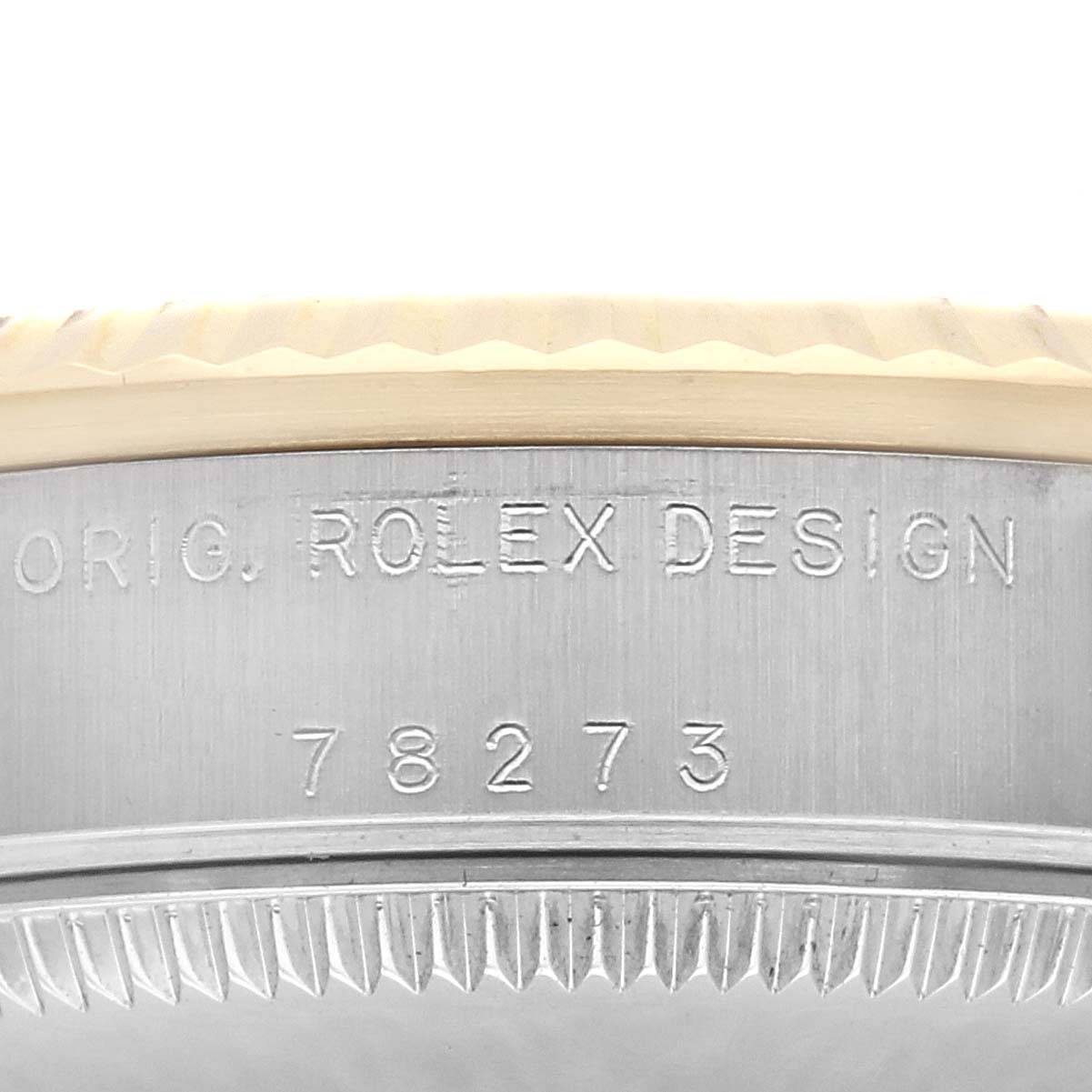 This image shows a close-up of the bezel and case side of a Rolex Mid-Size 178273 Women
s Steel and Gold (two tone) Silver Dial 178273 Women
s Steel and Gold (two tone) Silver Dial model, highlighting the engraved "Rolex Design 78273".