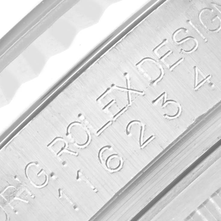 This image shows a close-up of the engraving on the case of a Rolex Datejust 116234 Men's Stainless Steel Mother of Pearl Dial 116234 Men's Stainless Steel Mother of Pearl Dial watch.