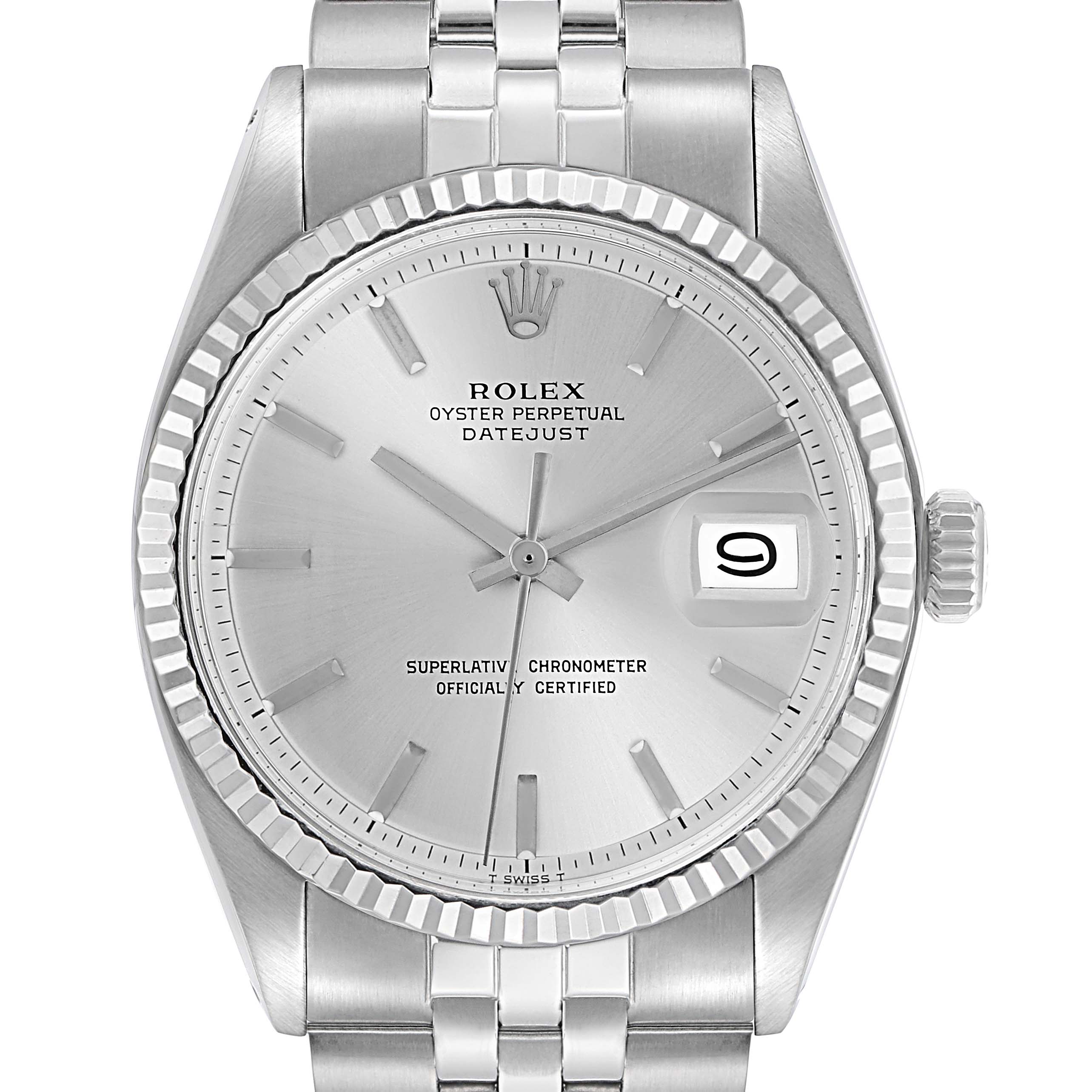 The Rolex Datejust 1601 Men
s Stainless Steel Silver Dial 1601 Men
s Stainless Steel Silver Dial watch is shown from a top-down angle, displaying its dial, fluted bezel, and part of the bracelet.