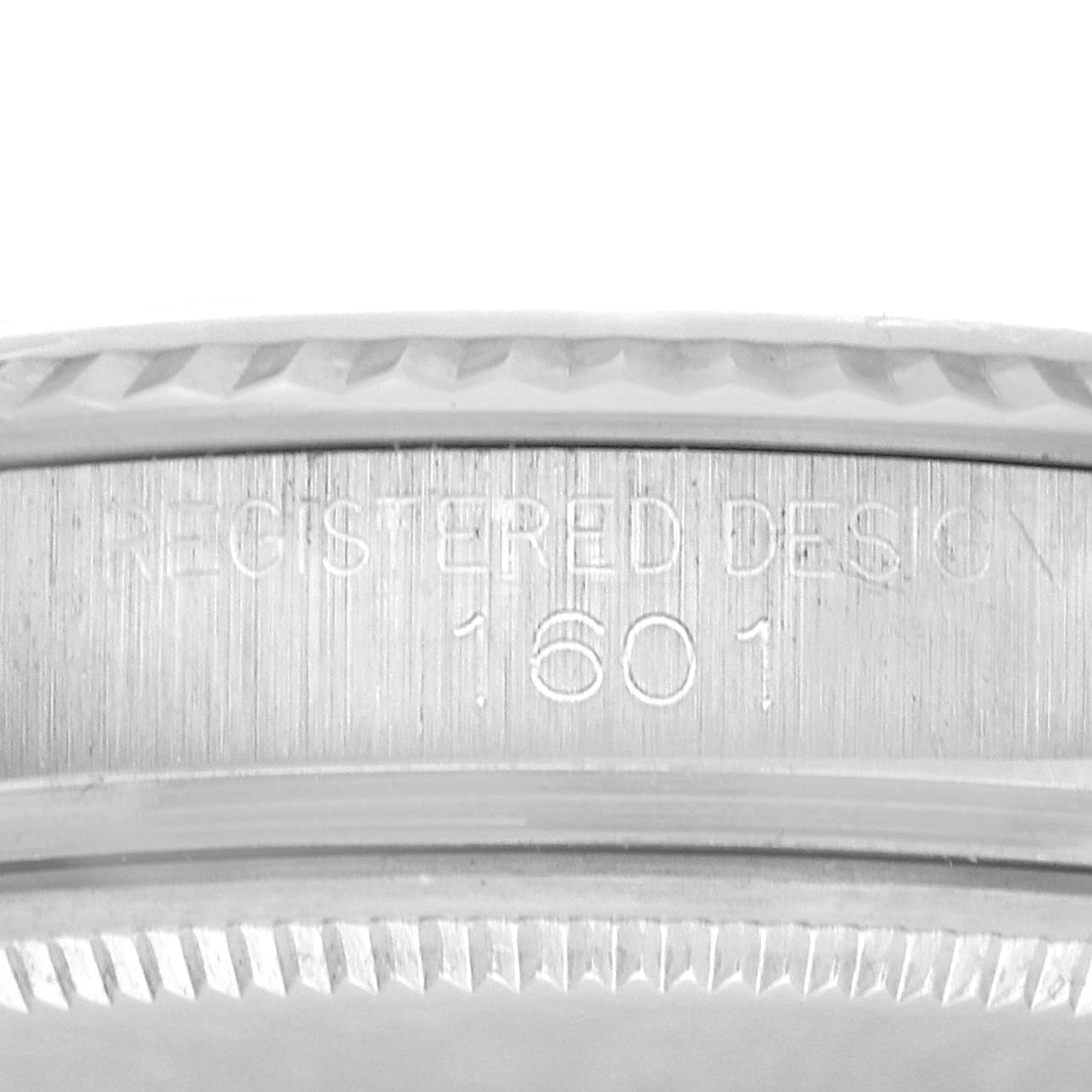 The image shows a close-up of the inner case with "REGISTERED DESIGN 1601" engraved on the Rolex Datejust 1601 Men
s Stainless Steel Silver Dial 1601 Men
s Stainless Steel Silver Dial.