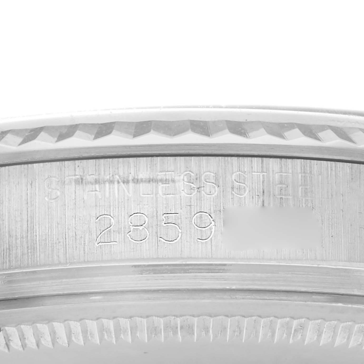 The image shows a close-up of the serial engraving on the side of the Rolex Datejust 1601 Men
s Stainless Steel Silver Dial 1601 Men
s Stainless Steel Silver Dial
s case.
