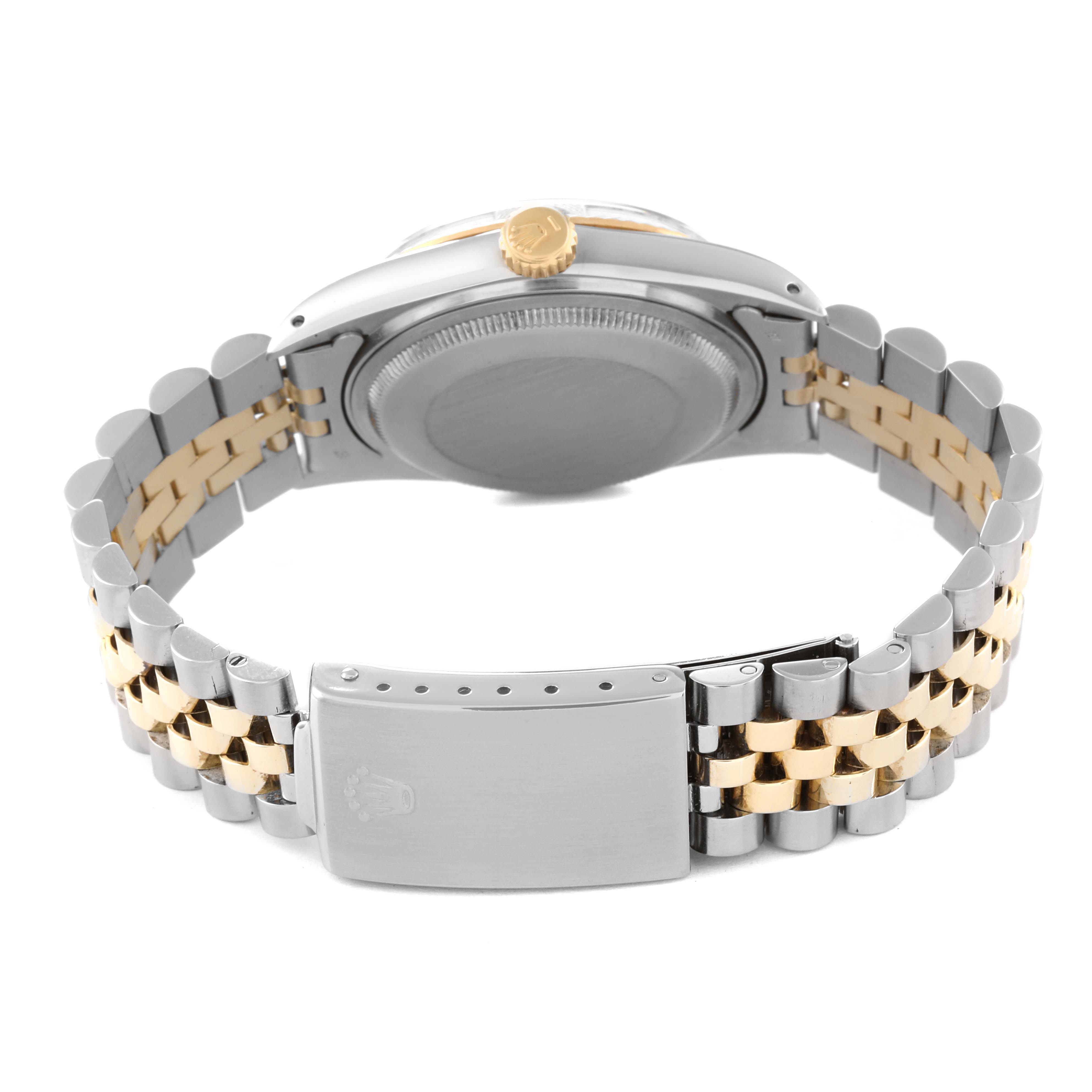 This image shows the back angle of a Rolex Datejust 16013 Men's Steel and Gold (two tone) Black Dial 16013 Men's Steel and Gold (two tone) Black Dial watch, focusing on its two-tone bracelet and closed clasp.