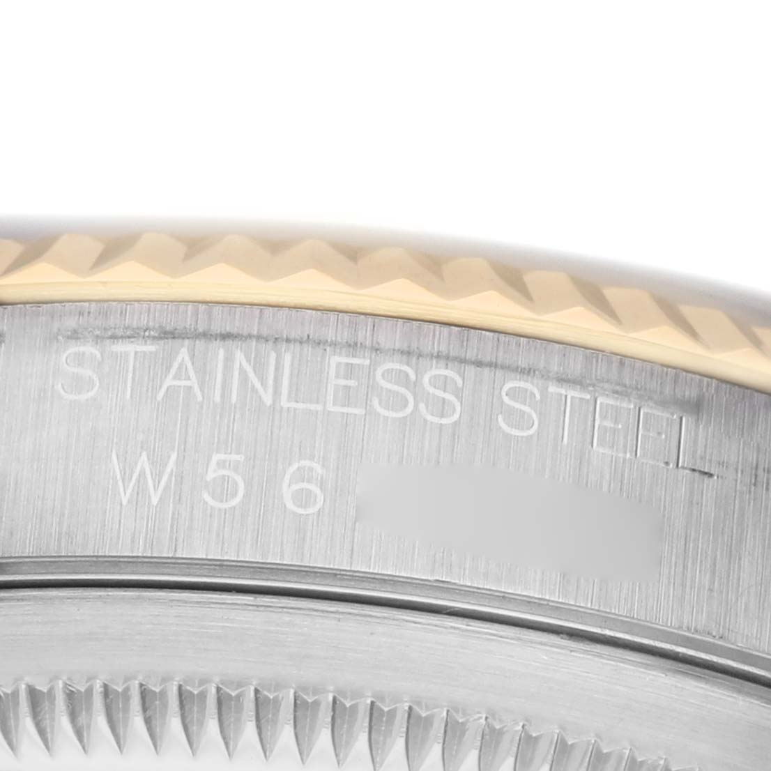 The image shows a close-up of the engraved side of a Rolex Datejust 16233 Men's Stainless Steel White Dial watch case, focusing on the bezel and part of the band.