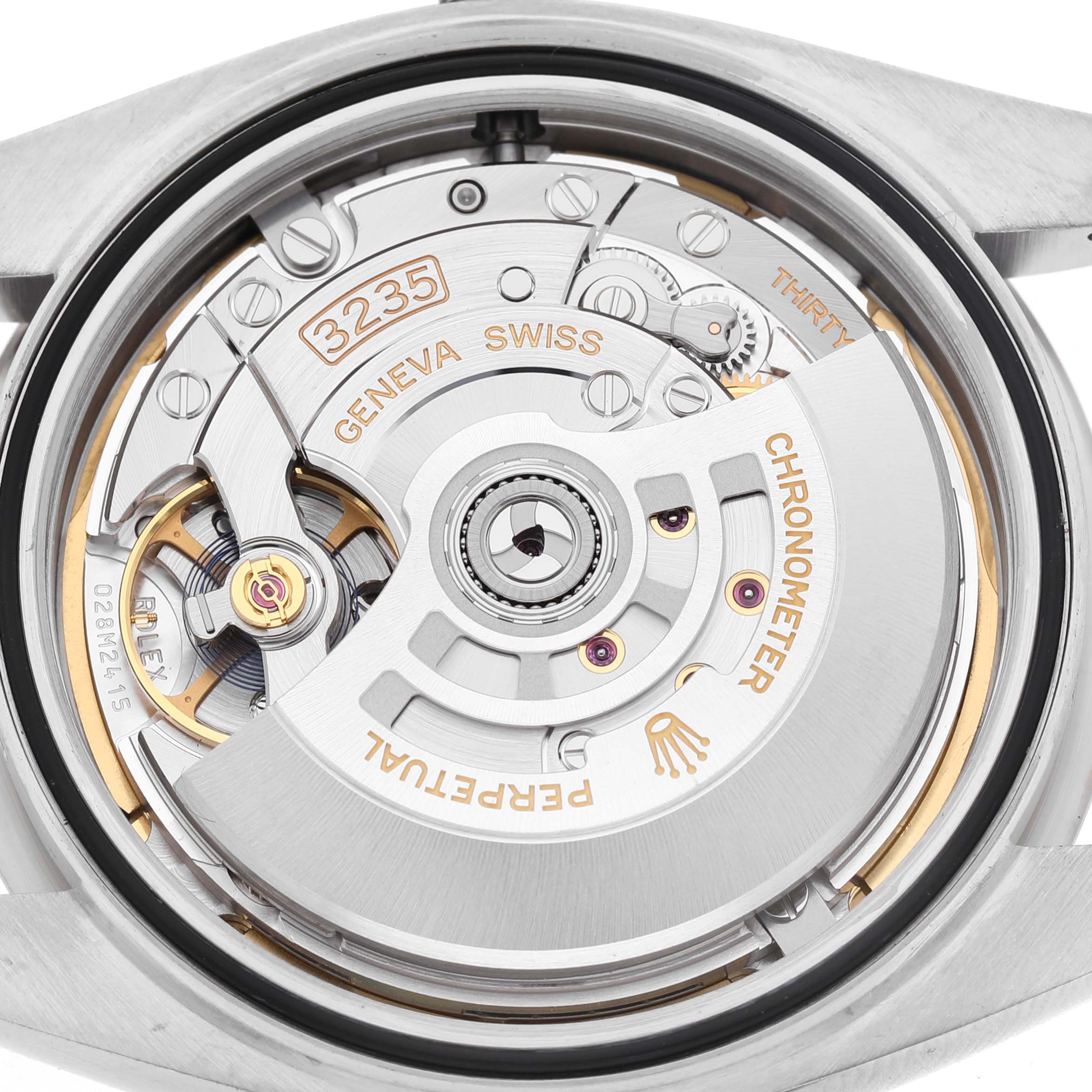 The image shows a close-up of the Rolex Datejust 41 126334 Men's Stainless Steel Grey Dial's movement, highlighting its rotor and intricate components.