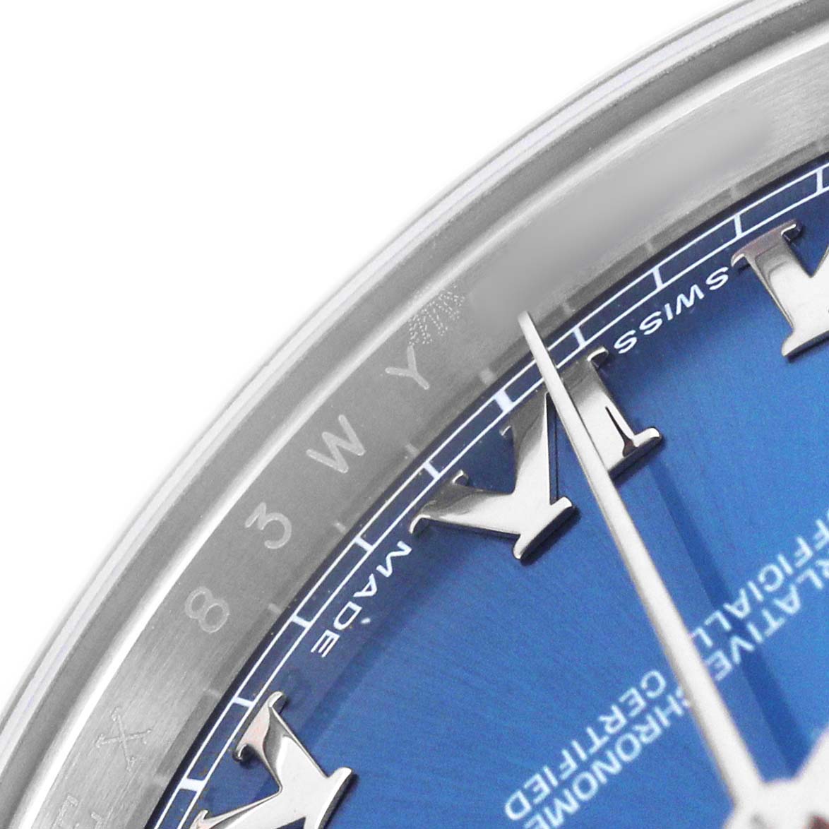 The image shows a close-up of the Rolex Datejust 41 116334 Men's Stainless Steel Blue Dial's dial, focusing on the blue face, Roman numerals, and part of the bezel.