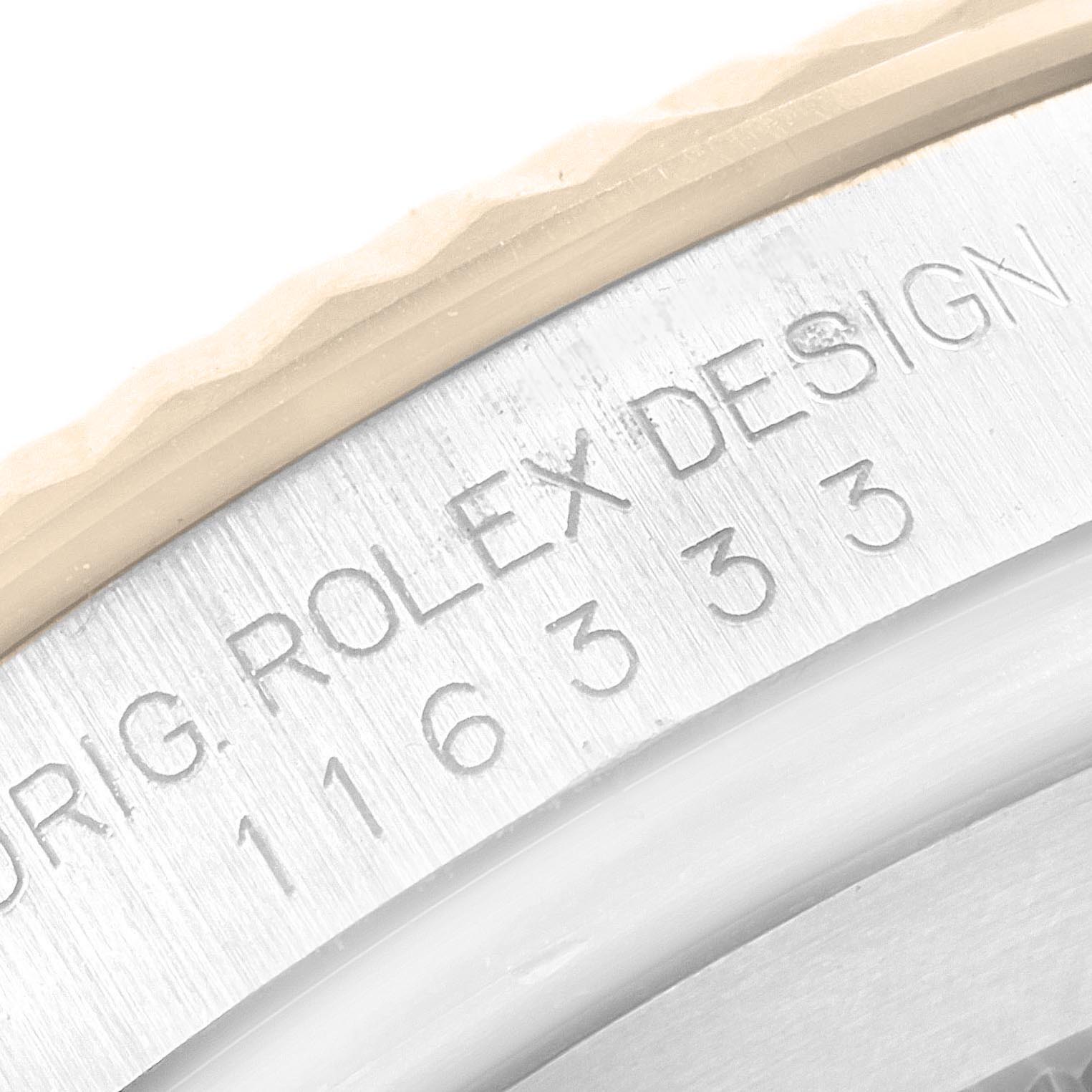 The image shows an angled close-up of the Rolex Datejust 41 116333 Men's Steel and Gold (two tone) Black Dial's engraved rim with the model number and "ROLEX DESIGN" text.