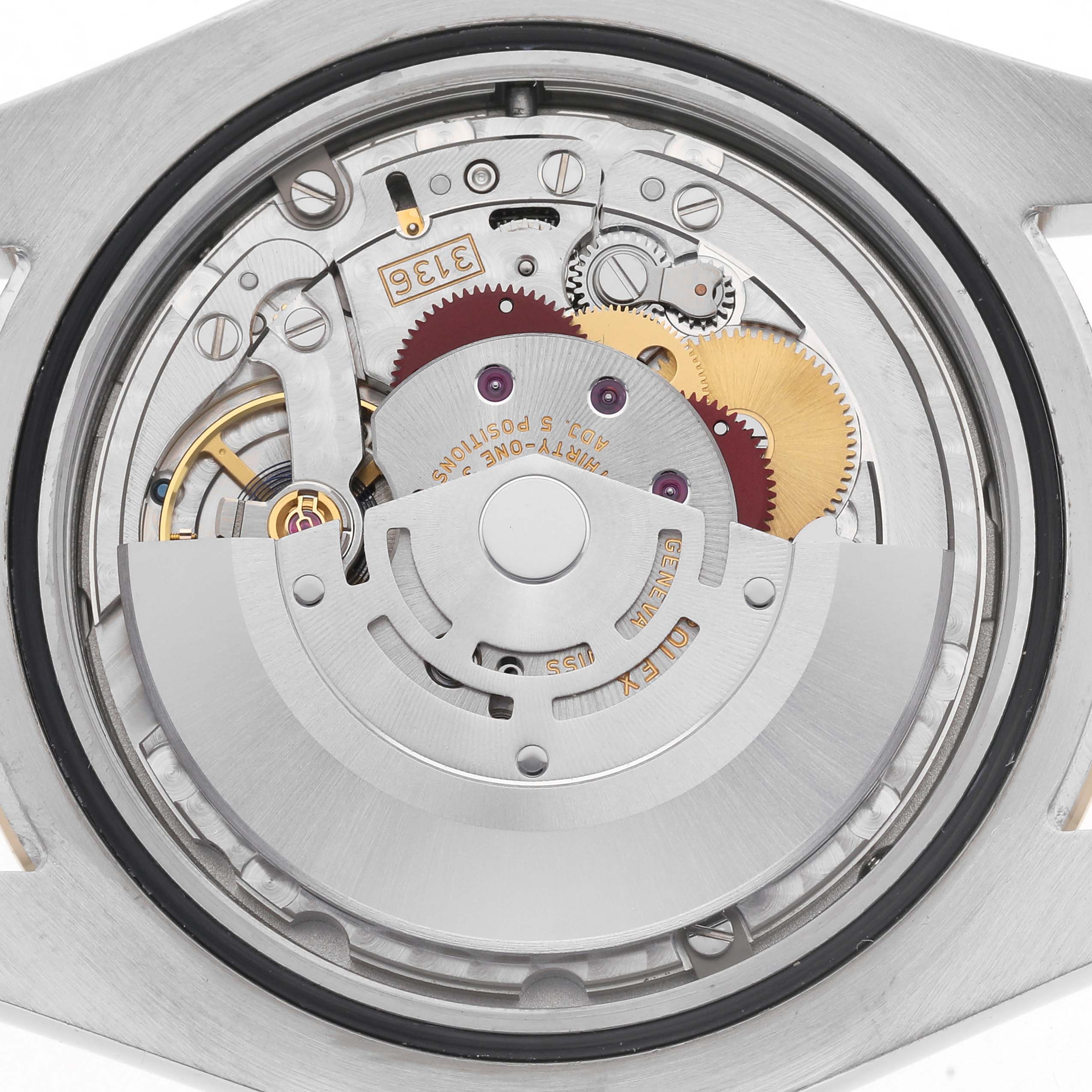 The image shows the movement mechanism of a Rolex Datejust 41 116333 Men
s Steel and Gold (two tone) Black Dial 116333 Men
s Steel and Gold (two tone) Black Dial, viewed from the back, highlighting gears and rotors.