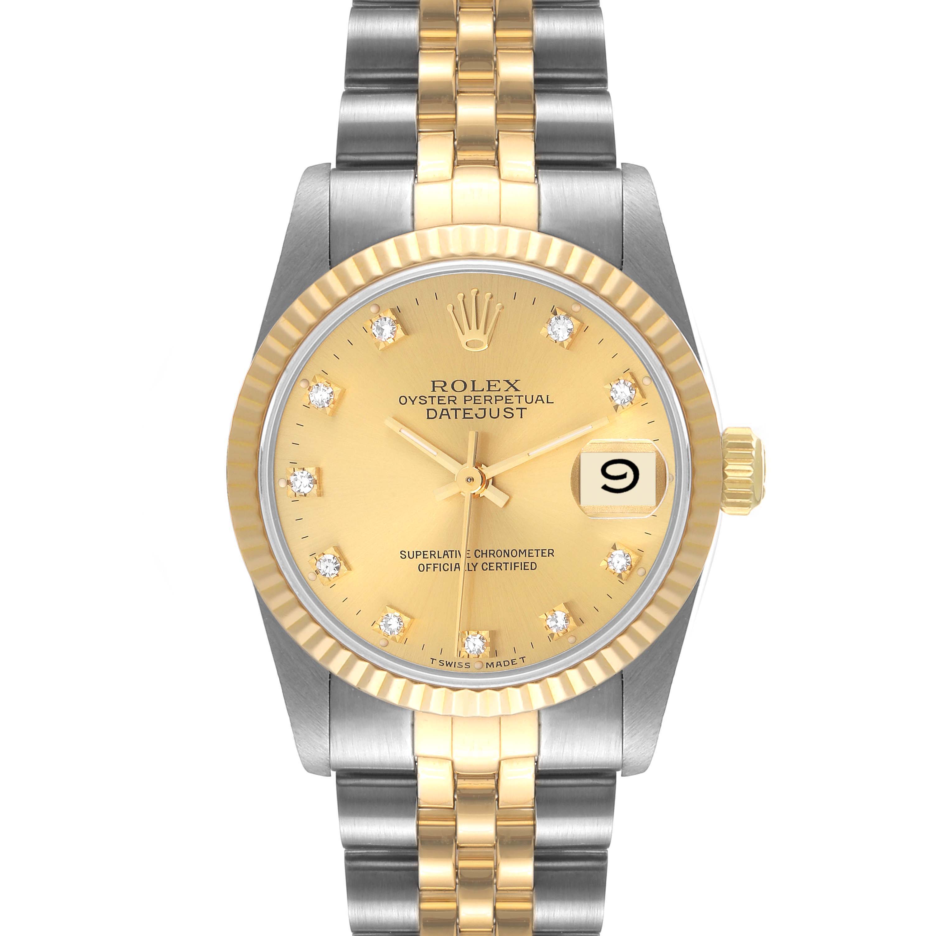 This image shows the front view of a Rolex Datejust 68273 Women
s Steel and Gold (two tone) Champagne Dial 68273 Women
s Steel and Gold (two tone) Champagne Dial watch, highlighting its gold dial, diamond hour markers, and two-tone bracelet.