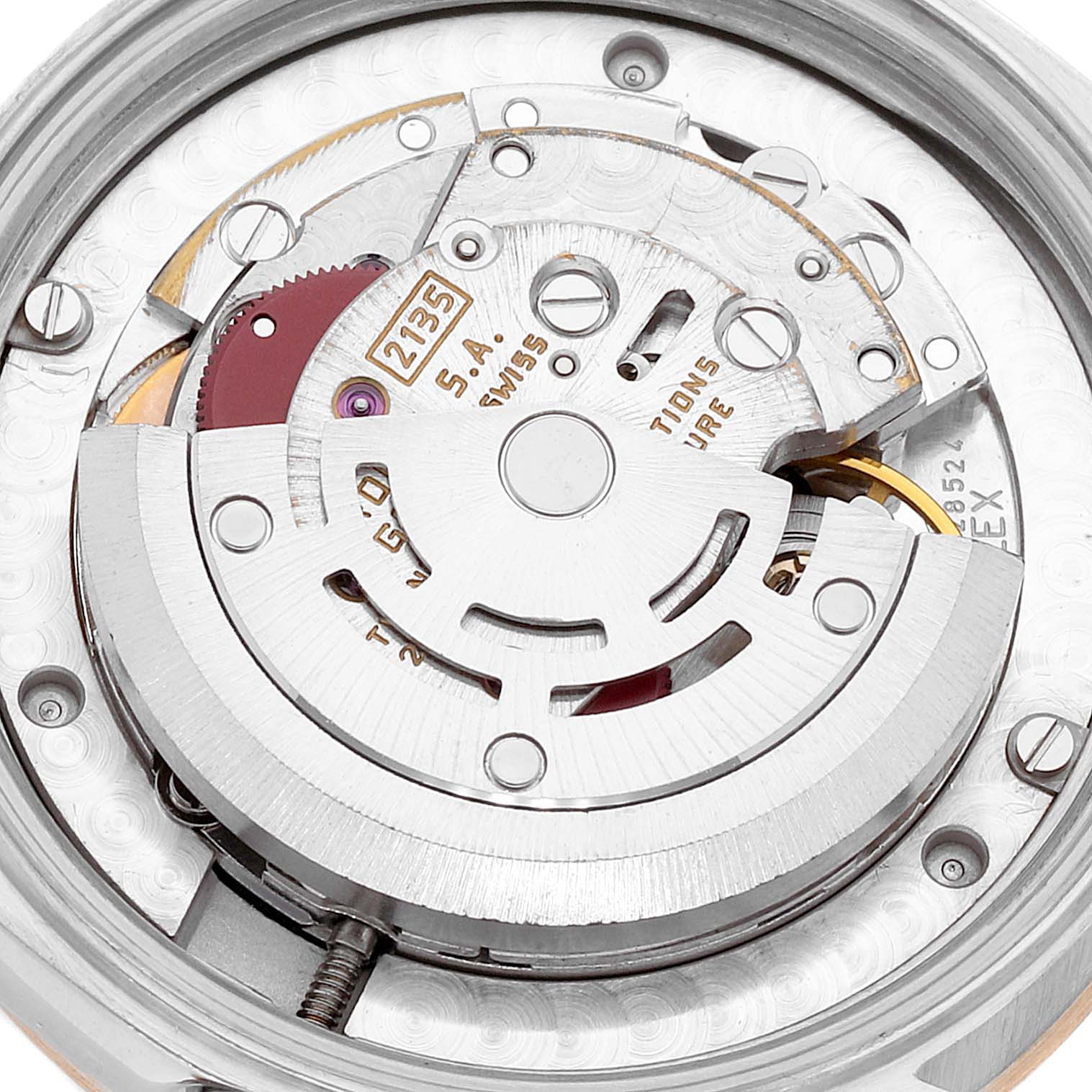 The image shows a close-up view of the internal mechanism of a Rolex Datejust 68273 Women
s Steel and Gold (two tone) Champagne Dial 68273 Women
s Steel and Gold (two tone) Champagne Dial watch, specifically its movement parts.