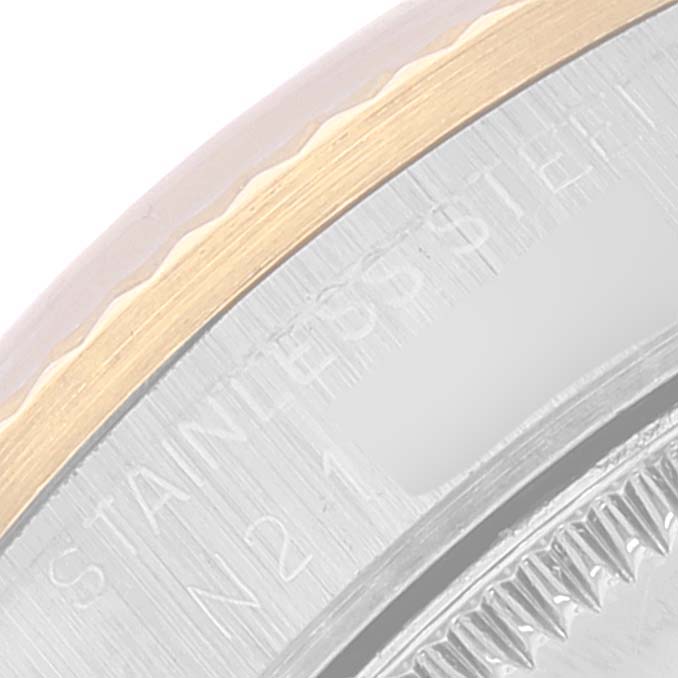 The image shows a close-up of the stainless steel and gold case with the bezel of a Rolex Datejust 68273 Women
s Steel and Gold (two tone) Champagne Dial 68273 Women
s Steel and Gold (two tone) Champagne Dial watch.