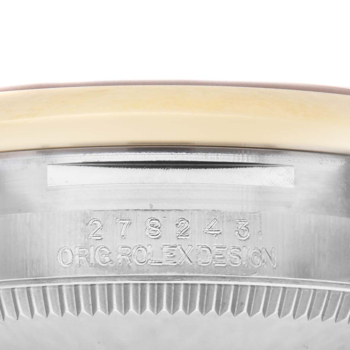 The image shows the side of the Rolex Mid-Size 278243 Women
s Steel and Gold (two tone) Champagne Dial 278243 Women
s Steel and Gold (two tone) Champagne Dial watch case with engraved model number and "Orig Rolex Design."