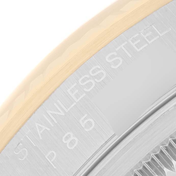 This is a close-up of the bezel and case of a Rolex Datejust 16233 Men's Steel and Gold (two tone) White Dial 16233 Men's Steel and Gold (two tone) White Dial, showing the "STAINLESS STEEL" engraving.