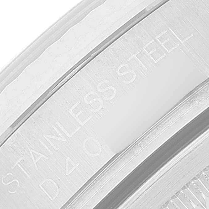 This image shows a close-up of the side engraving on the stainless steel case of a Rolex Datejust 116234 Men's Stainless Steel Black Dial 116234 Men's Stainless Steel Black Dial watch.