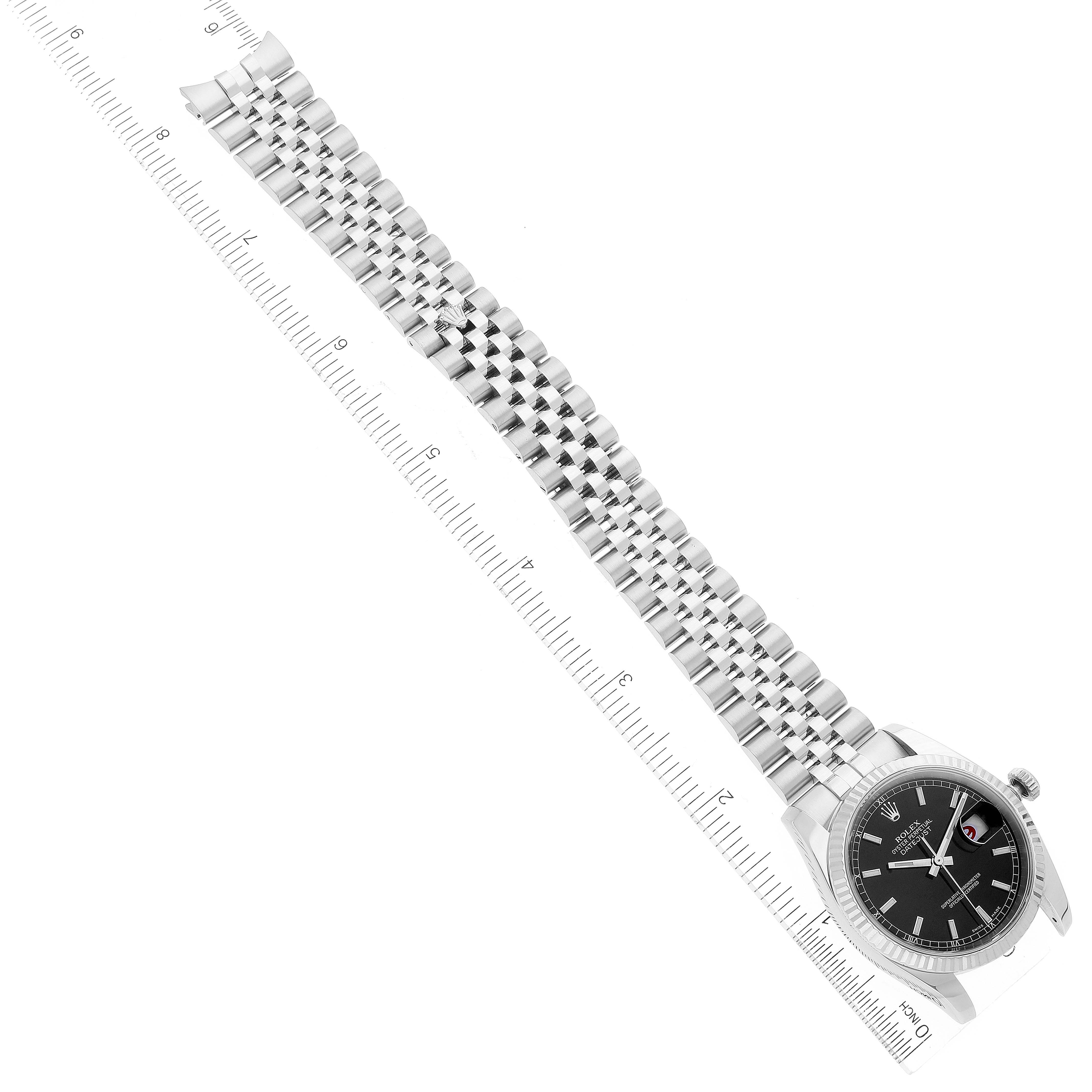 The Rolex Datejust 116234 Men's Stainless Steel Black Dial 116234 Men's Stainless Steel Black Dial watch is shown from an overhead angle, showcasing the full bracelet length and dial.