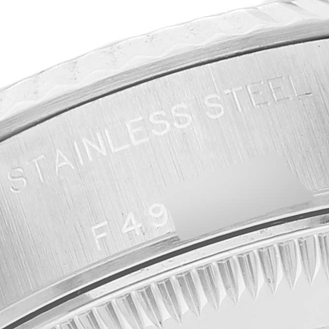 The image shows a close-up of the caseback engraving of a Rolex Datejust 79174 Women's Stainless Steel Black Dial 79174 Women's Stainless Steel Black Dial watch, highlighting the "Stainless Steel" text.