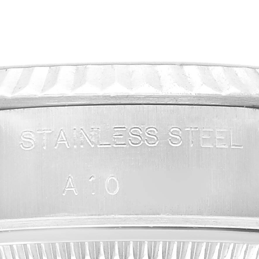 This image shows a close-up of the stainless steel bezel inscription of a Rolex Datejust 69174 Women's Stainless Steel Blue Dial 69174 Women's Stainless Steel Blue Dial watch.