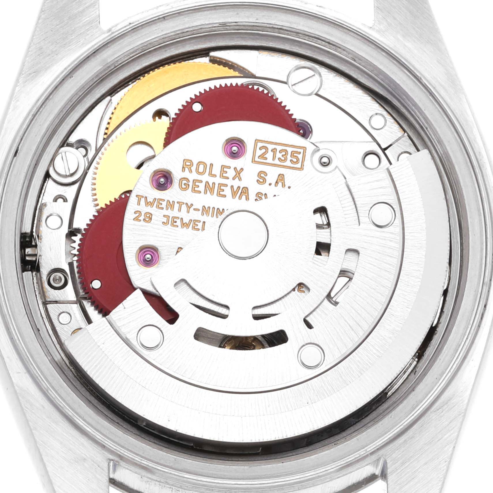 This image shows a close-up of the movement inside a Rolex Datejust 69174 Women's Stainless Steel Blue Dial 69174 Women's Stainless Steel Blue Dial watch, highlighting its gears and intricate components.