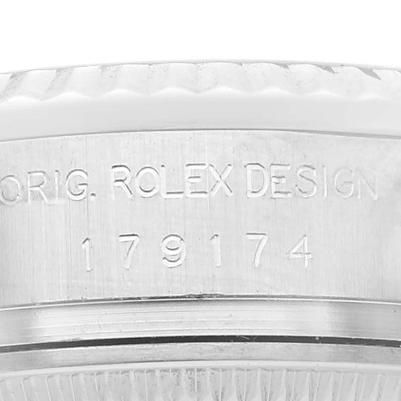This close-up image shows the engraved model number and design details on the case of a Rolex Datejust 179174 Women's Stainless Steel Mother of Pearl Dial 179174 Women's Stainless Steel Mother of Pearl Dial watch.