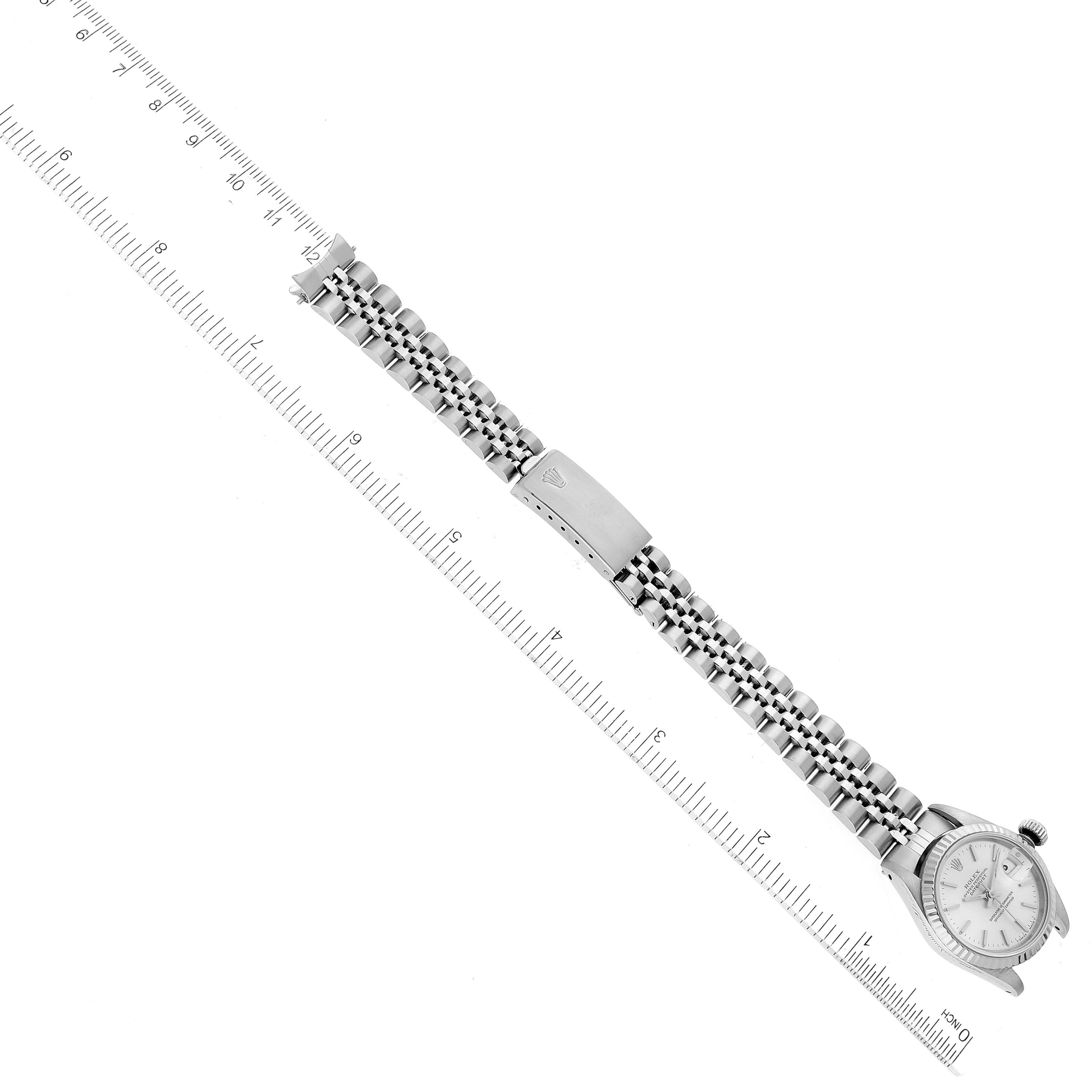 The image shows a Rolex Datejust 69174 Women's Stainless Steel Silver Dial 69174 Women's Stainless Steel Silver Dial watch laid flat, displaying the face and full length of the bracelet against a ruler for scale.