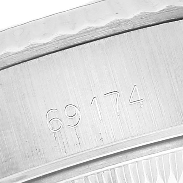 The image shows a close-up of the case back edge with the model number of a Rolex Datejust 69174 Women's Stainless Steel Silver Dial 69174 Women's Stainless Steel Silver Dial.
