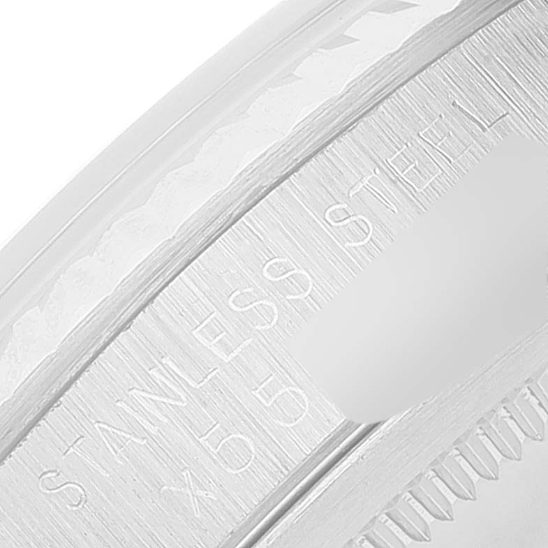 This close-up image shows the stainless steel engraving on the inner bezel of a Rolex Datejust 16234 Men's Stainless Steel Silver Dial 16234 Men's Stainless Steel Silver Dial watch.