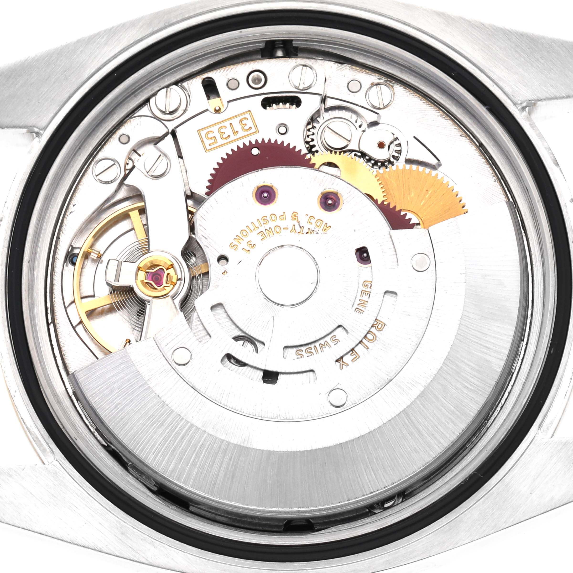 The image shows the movement of a Rolex Datejust 116233 Men
s Steel and Gold (two tone) Black Dial 116233 Men
s Steel and Gold (two tone) Black Dial from the back, highlighting gears and the rotor.