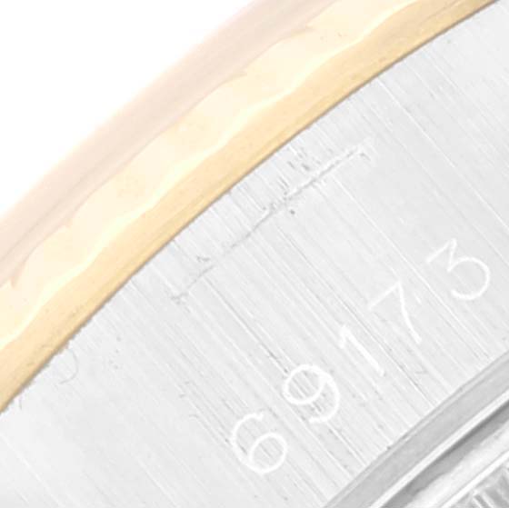 This close-up image shows the edge of the bezel and part of the case with the model number "69173" of a Rolex Datejust 69173 Women's Steel and Gold (two tone) Champagne Dial 69173 Women's Steel and Gold (two tone) Champagne Dial watch.