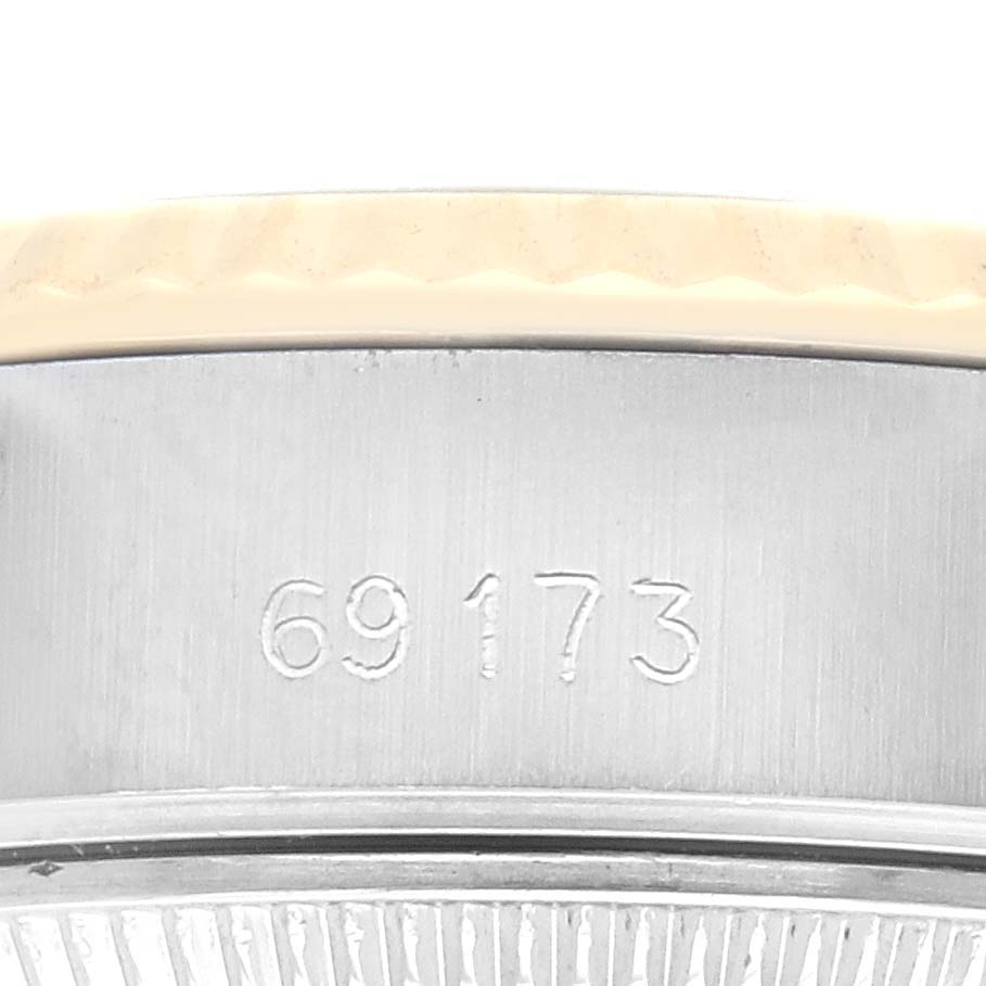 The image shows the side casing of a Rolex Datejust 69173 Women's Steel and Gold (two tone) Champagne Dial 69173 Women's Steel and Gold (two tone) Champagne Dial with the model number 69173 engraved.