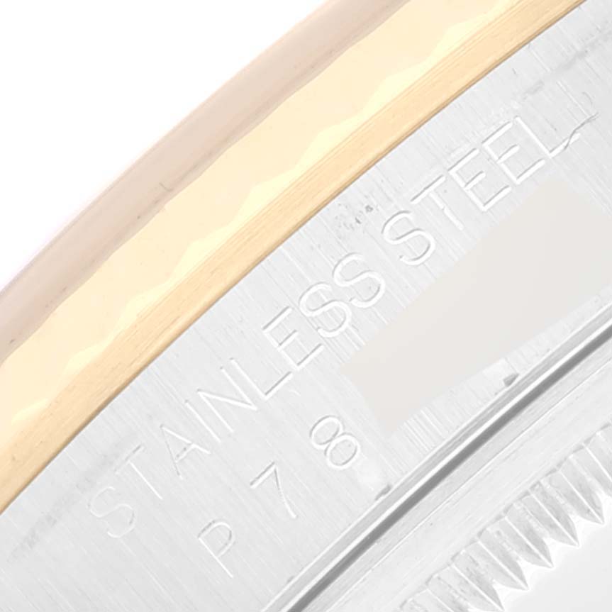 The image shows a close-up of the stainless steel and gold bezel engraving on a Rolex Datejust 16233 Men's Steel and Gold (two tone) Grey Dial 16233 Men's Steel and Gold (two tone) Grey Dial watch.