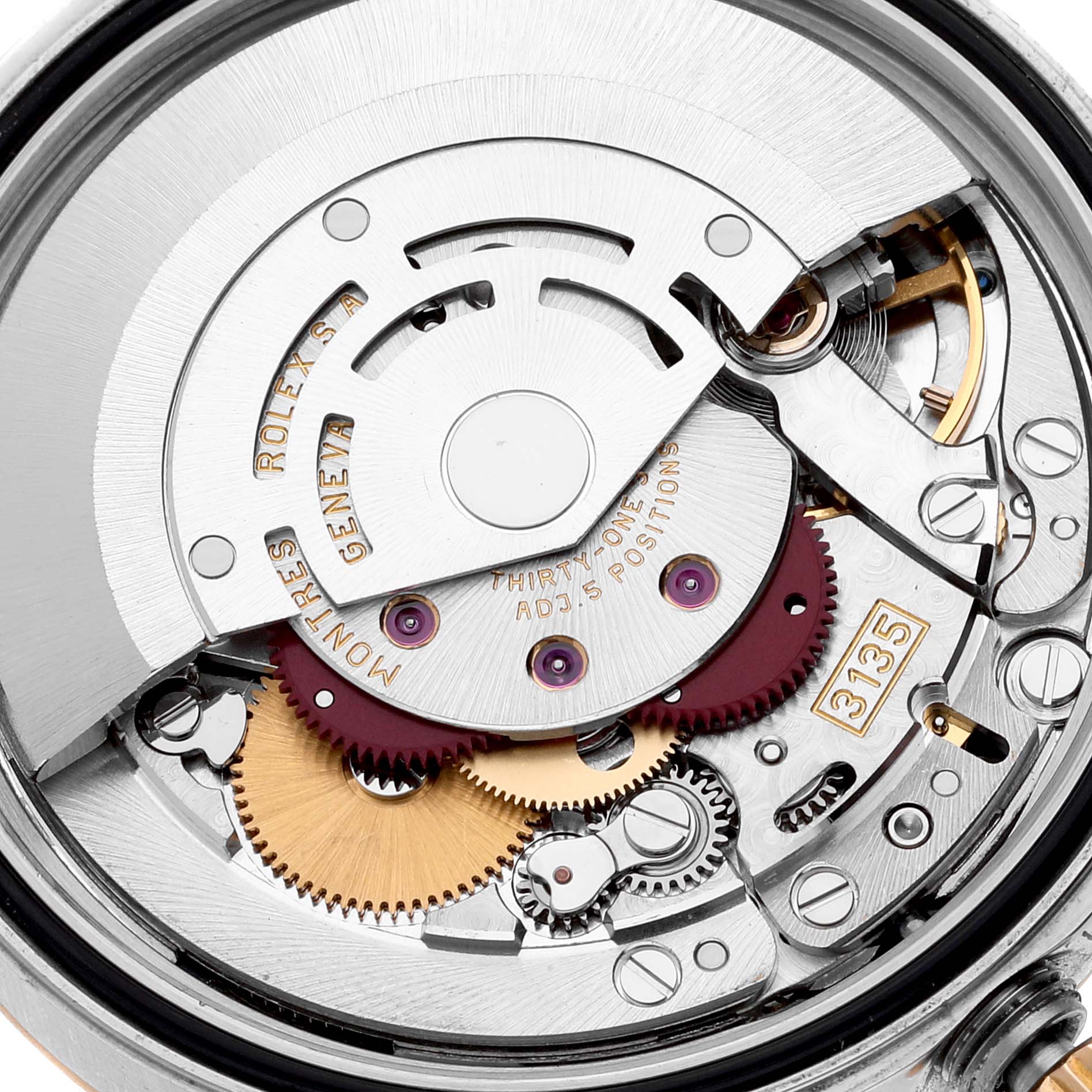 This image shows the internal mechanism of a Rolex Datejust 16233 Men's Steel and Gold (two tone) Mother of Pearl Dial 16233 Men's Steel and Gold (two tone) Mother of Pearl Dial watch, including gears and the rotor.