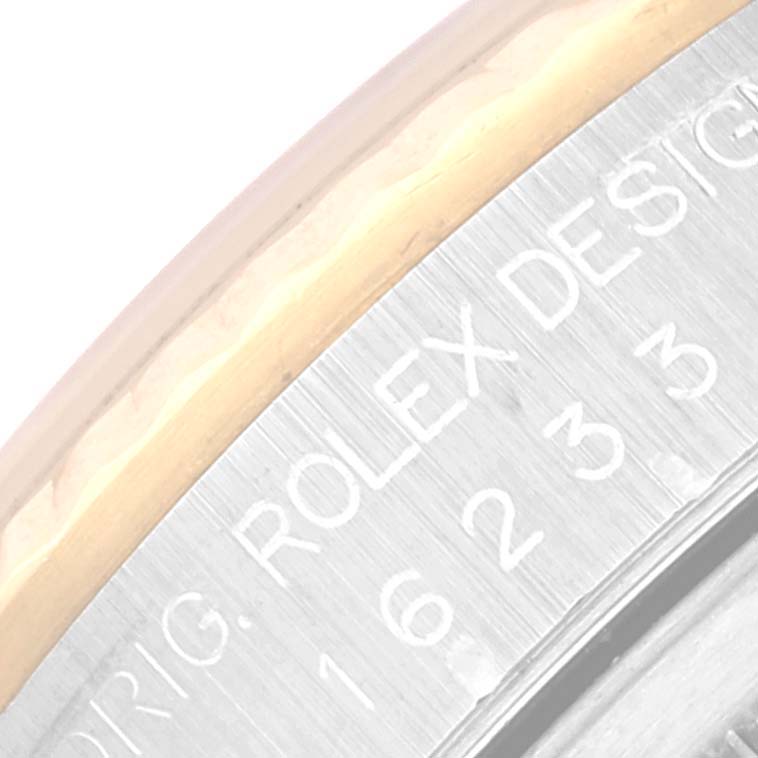 The image shows a close-up of the bezel and engraved text on the case of a Rolex Datejust 16233 Men's Steel and Gold (two tone) Mother of Pearl Dial 16233 Men's Steel and Gold (two tone) Mother of Pearl Dial watch.