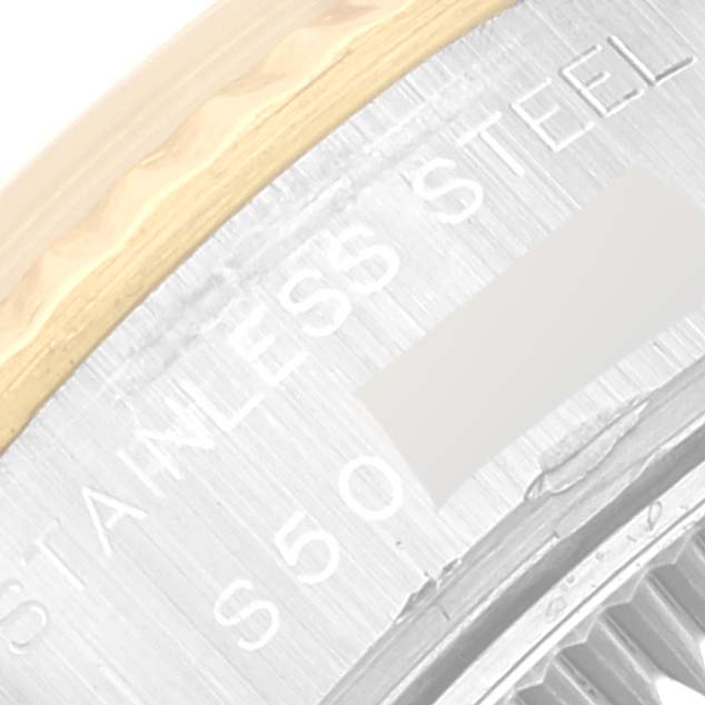 The image shows a close-up of the Rolex Datejust 69173 Women's Steel and Gold (two tone) Silver Dial 69173 Women's Steel and Gold (two tone) Silver Dial watch, highlighting part of the bezel and the engraved text on the stainless steel case.