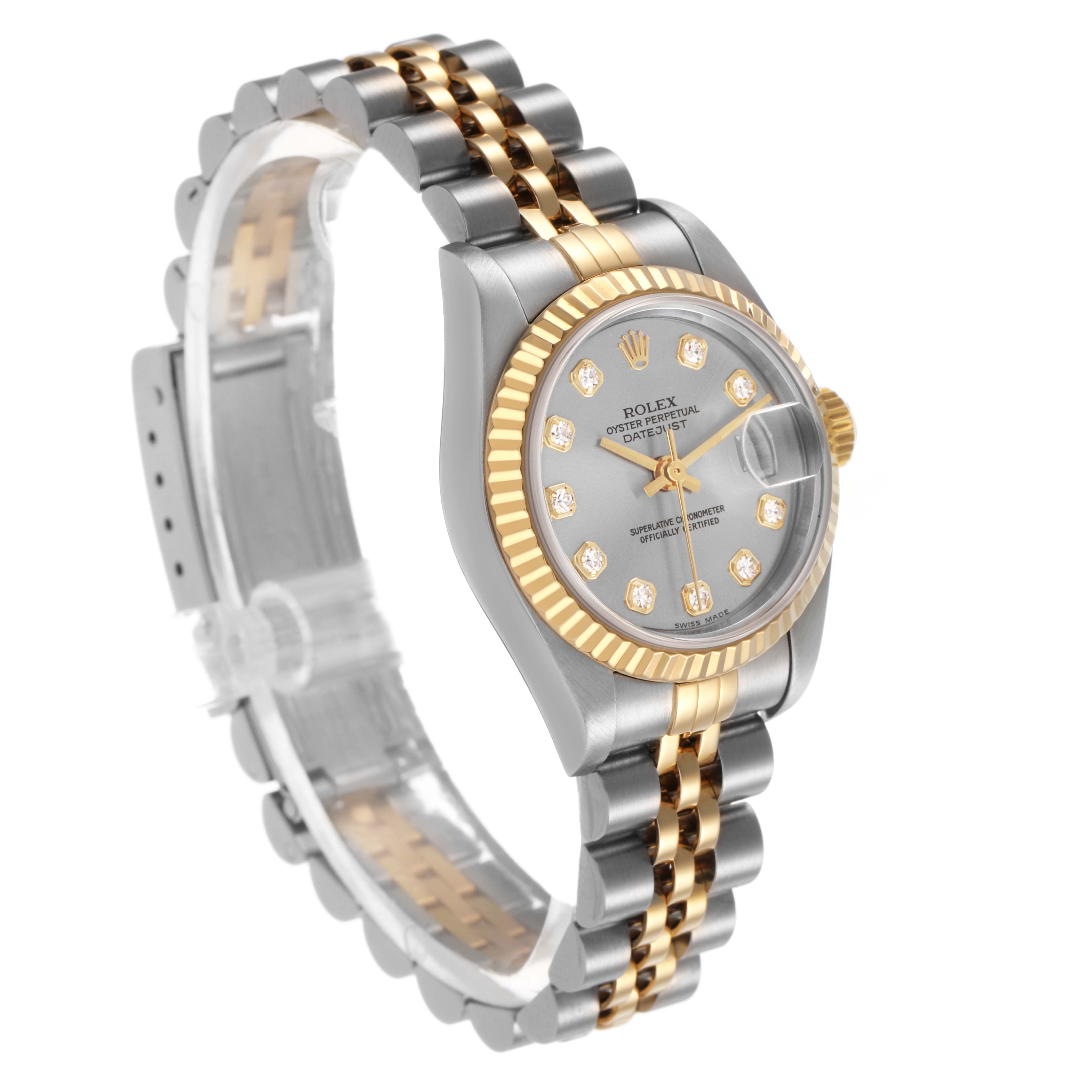 The Rolex Datejust 79173 Women's Steel and Gold (two tone) Silver Dial watch is shown at an angle highlighting the fluted bezel, jubilee bracelet, and silver dial with diamond markers.