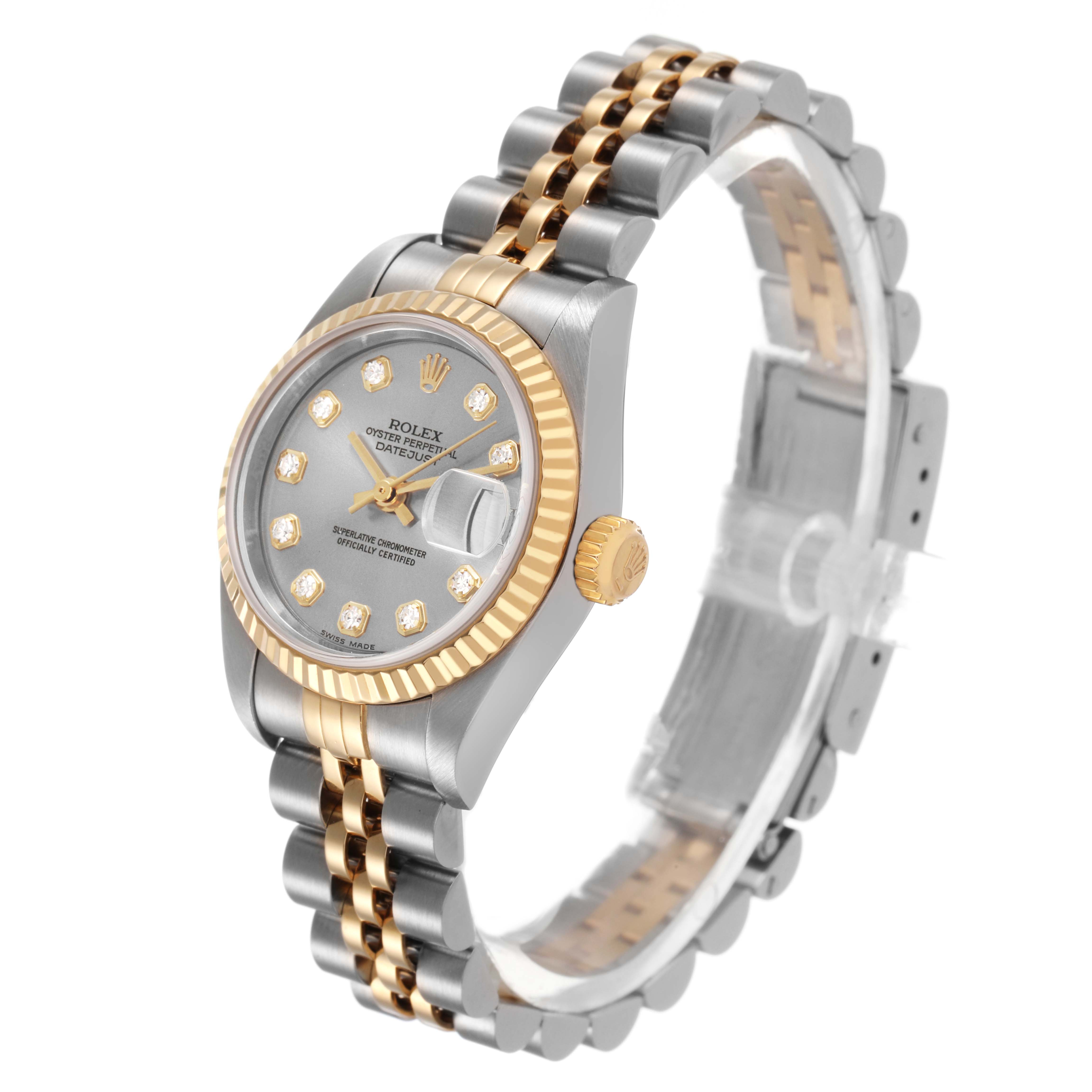 The Rolex Datejust 79173 Women's Steel and Gold (two tone) Silver Dial watch is shown at a three-quarter angle, displaying the face, fluted bezel, and Jubilee bracelet.