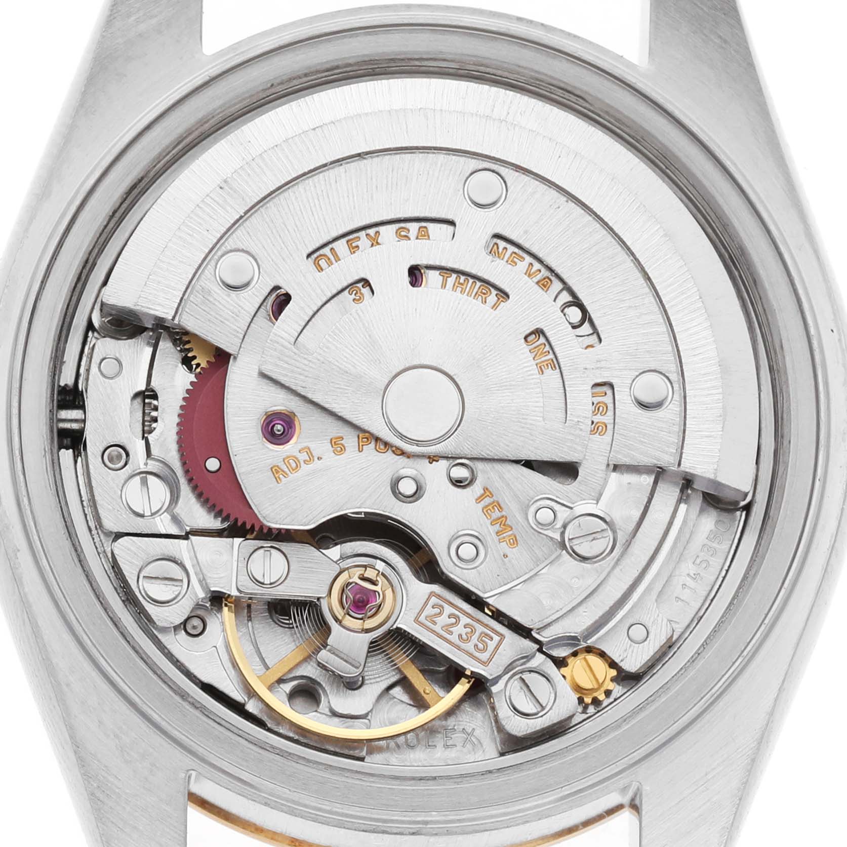 The image shows the inner mechanism of a Rolex Datejust 79173 Women's Steel and Gold (two tone) Silver Dial watch from a top-down angle, highlighting the movement components.