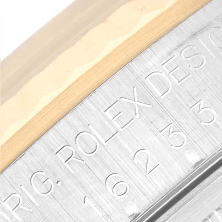 This close-up image of the Rolex Datejust 16233 Men's Steel and Gold (two tone) White Dial 16233 Men's Steel and Gold (two tone) White Dial watch shows the engraved model details on the side of the case.