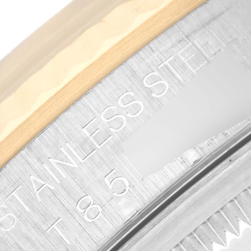 The image shows a close-up of the engraving on the side of the stainless steel case of a Rolex Datejust 16233 Men's Steel and Gold (two tone) White Dial 16233 Men's Steel and Gold (two tone) White Dial model.