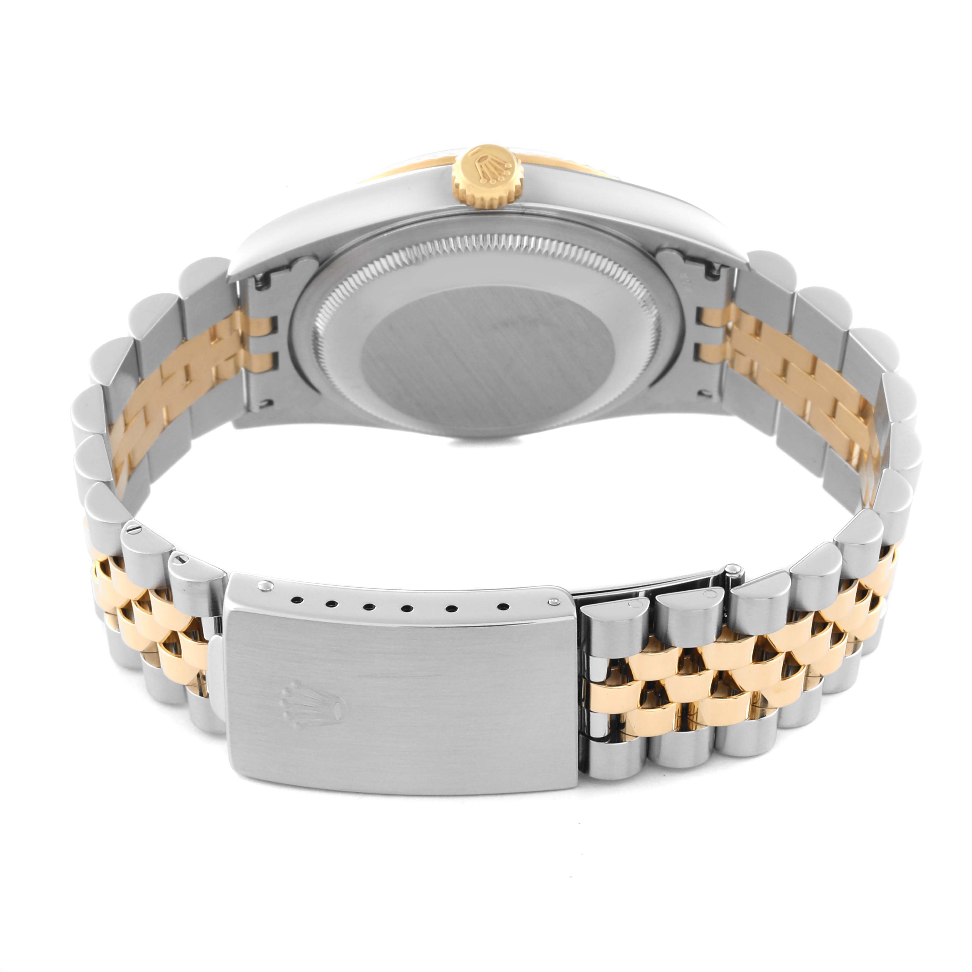The image shows the back view of a Rolex Datejust 16233 Men's Steel and Gold (two tone) White Dial 16233 Men's Steel and Gold (two tone) White Dial watch, highlighting the gold crown, case back, and two-tone bracelet with clasp.